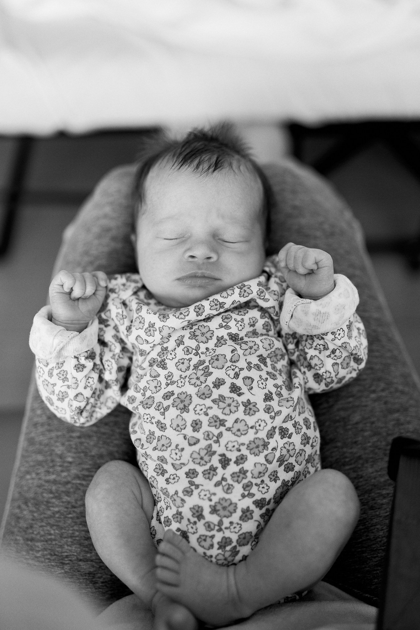 Fresh 48 Newborn baby laying in moms lap.jpg