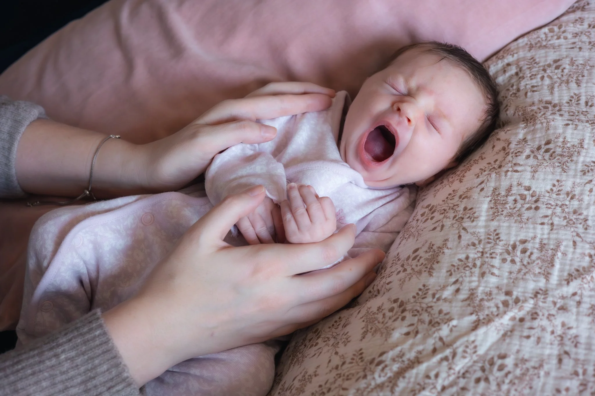 Newborn babygirl yawning