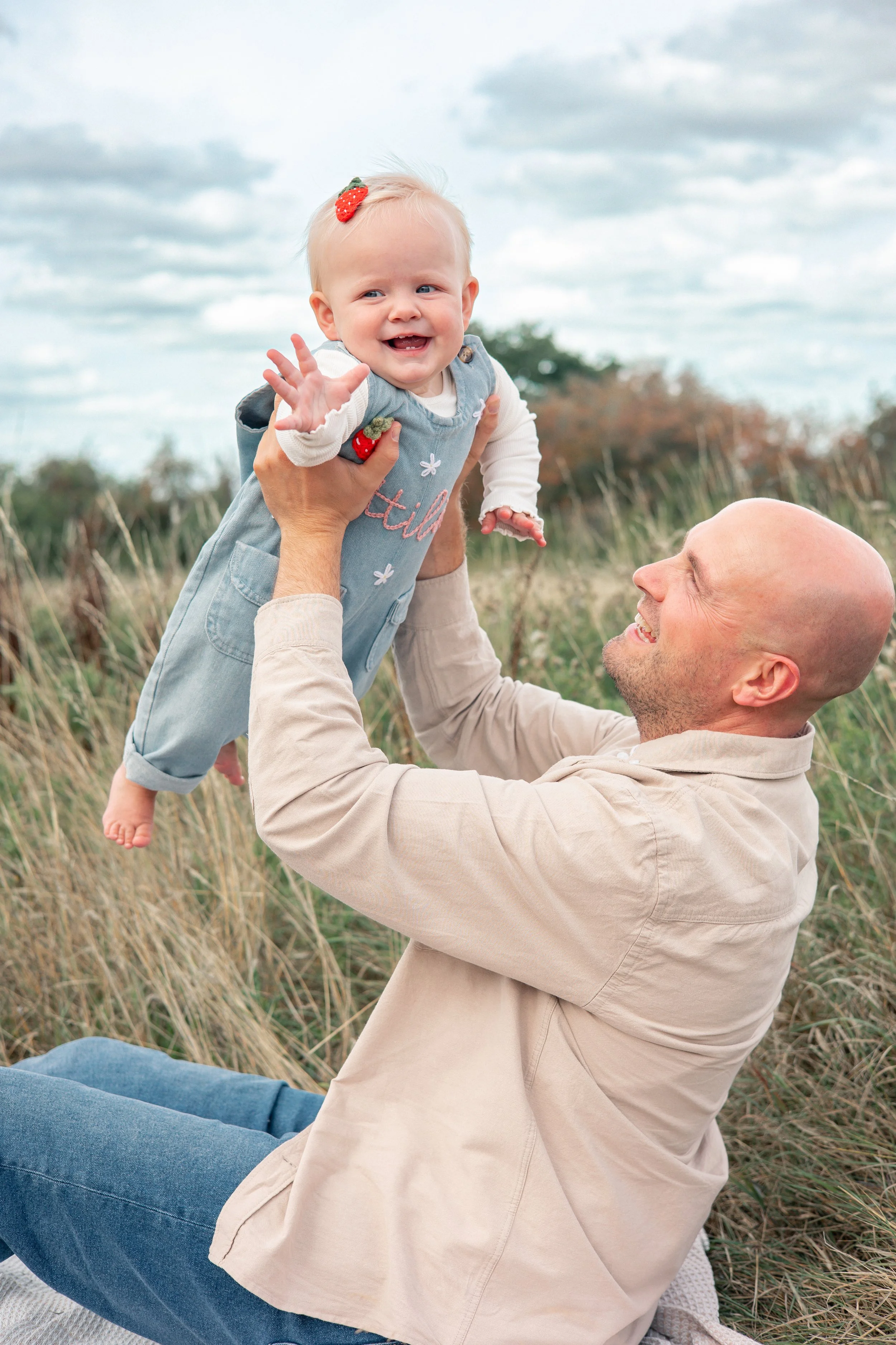 Photo of baby turning one with her daddy