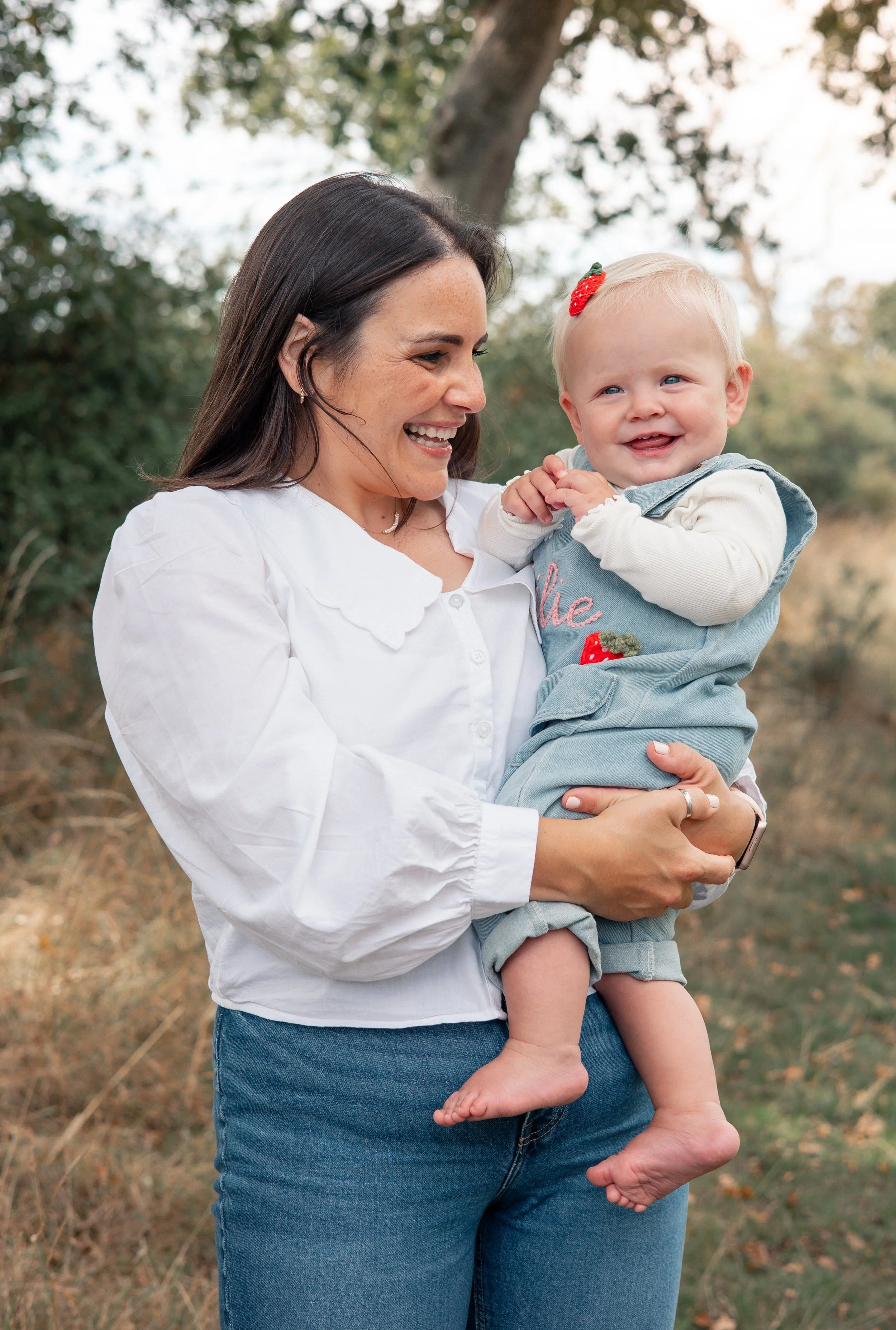 Mum and daughter bonding in a field in the Cotswolds