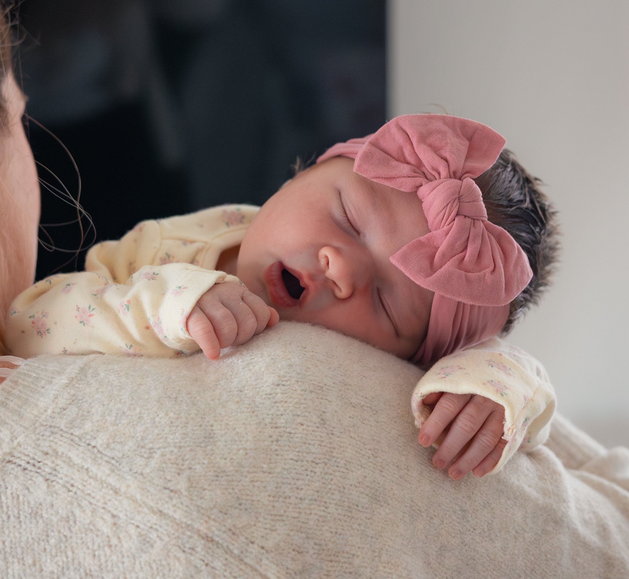 Sleepy newborn baby girl