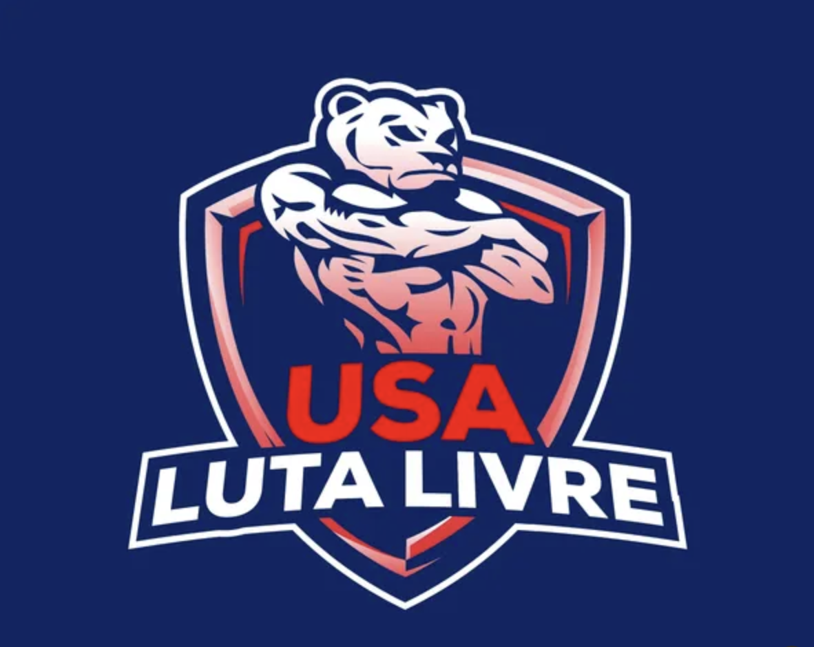 Logo featuring an illustration of a muscular lion with arms crossed, a shield outline, and text reading 'USA LUT A LIVRE' in white and red on a dark blue background.