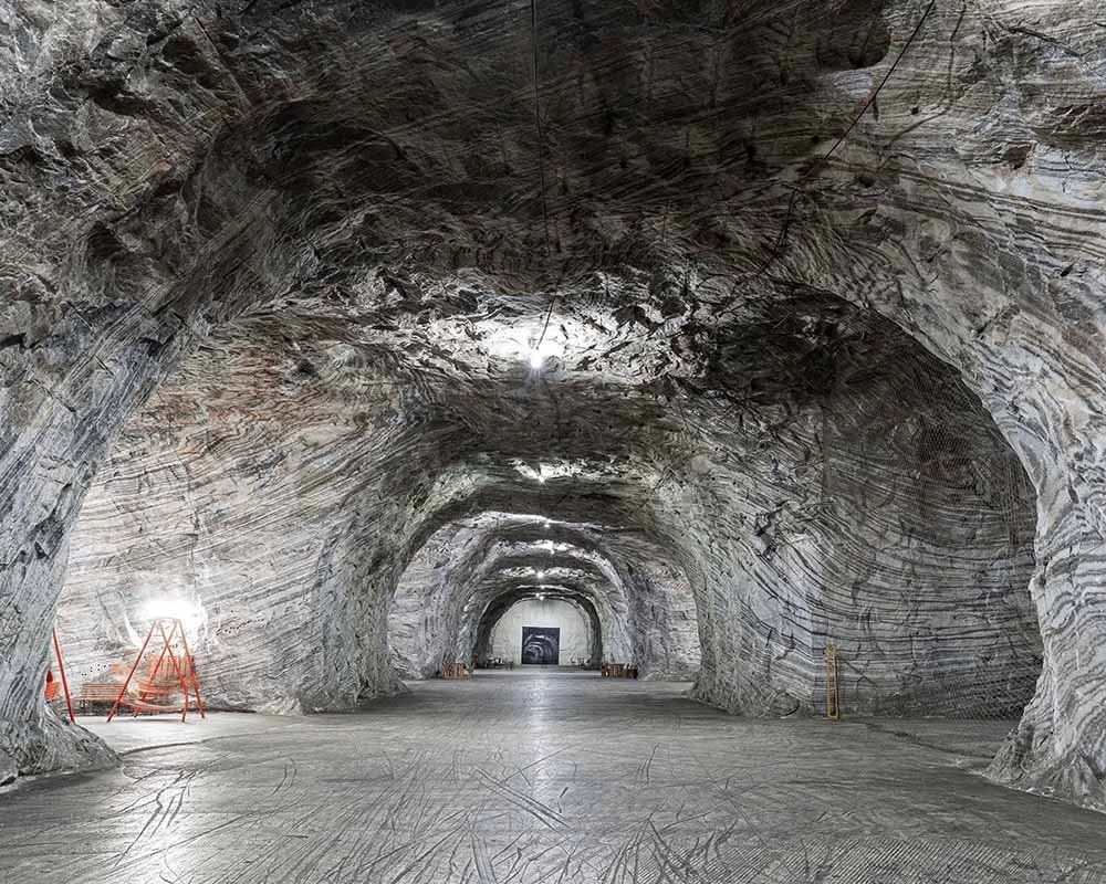 Vast Himalayan salt mine cave showing layers of white rock salt, source material for the Origin Salt Mill designed by London industrial designer Joe Slatter.