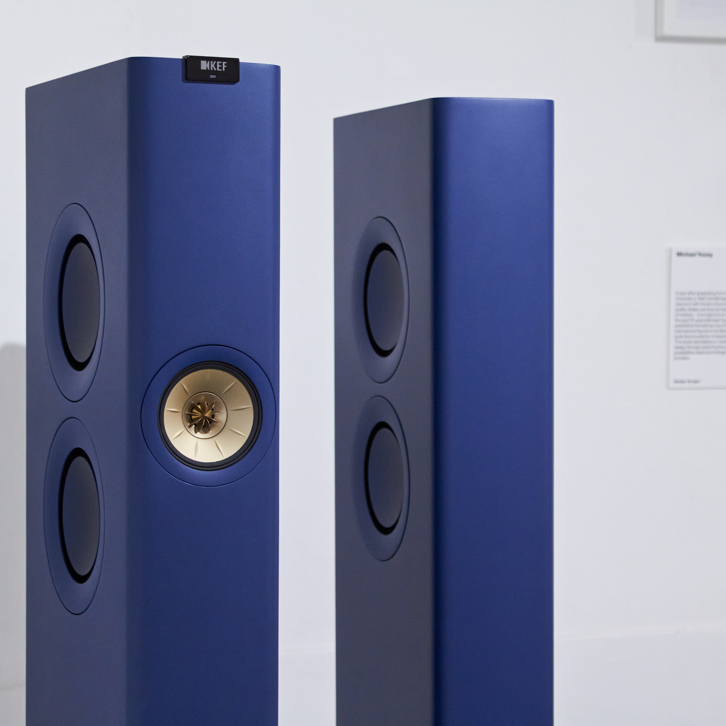 Close-up of blue KEF speaker by Michael Young displayed on a plinth in the Milano exhibition.