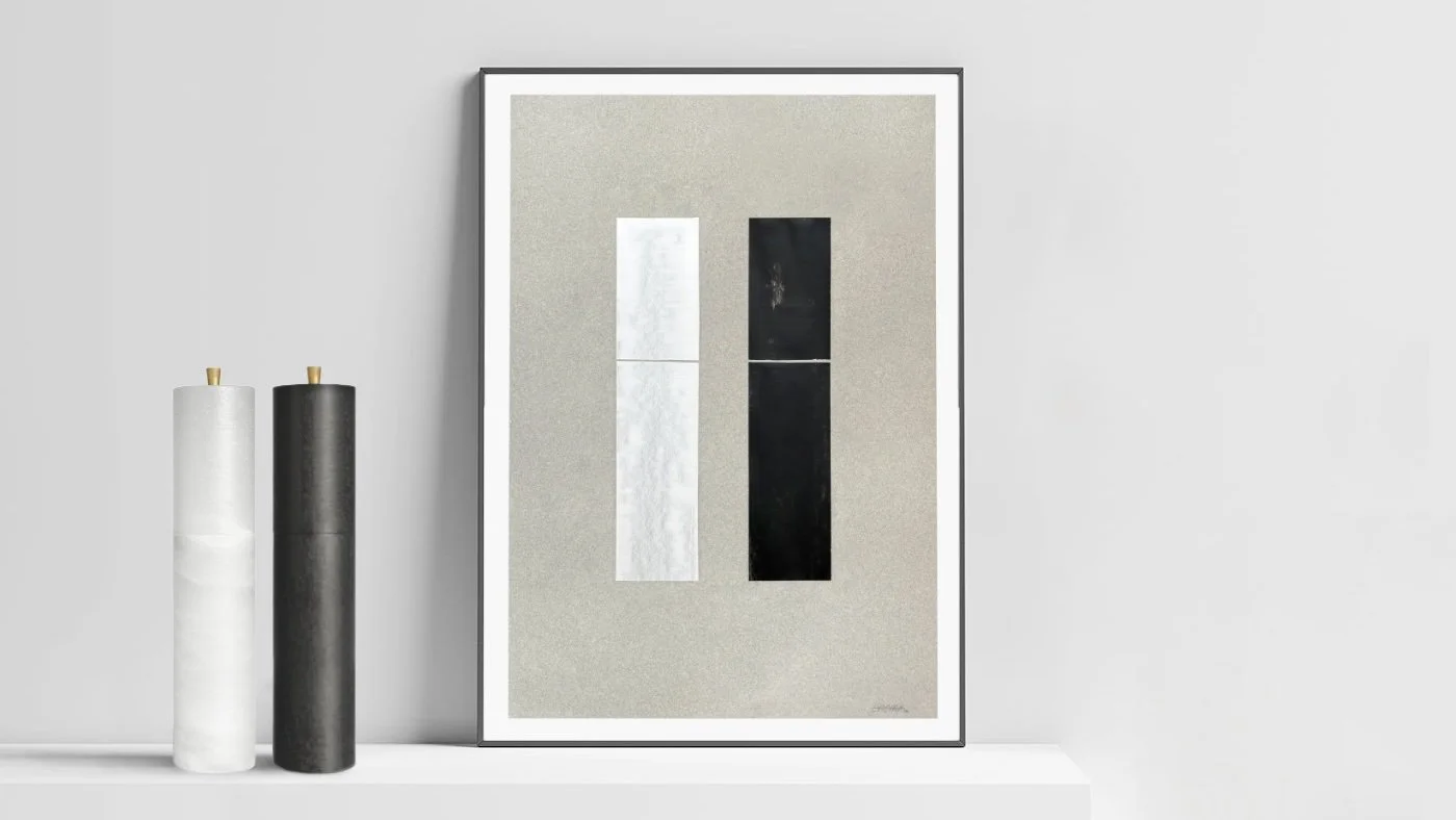 Minimalist framed painting of salt and pepper mills on grey paper displayed beside real prototypes, highlighting light and dark material contrast.