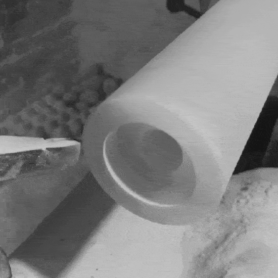 Close-up black-and-white GIF showing Himalayan salt spinning on lathe as it’s hand-turned into cylindrical mill form by London product designer Joe Slatter.