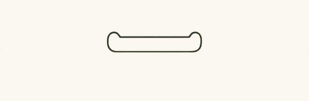 Close-up of a U-shaped metal paperclip on a plain light-colored background.