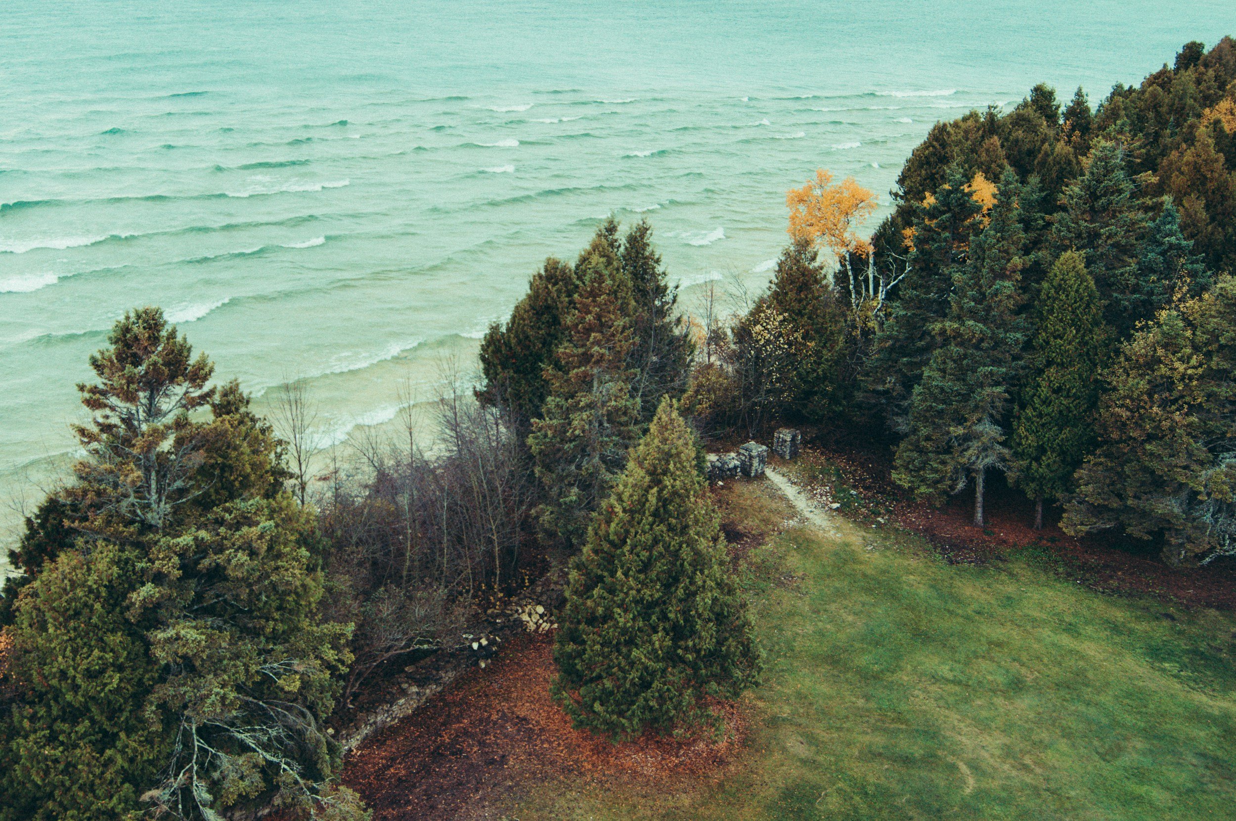 A quiet tree-lined road in Door County, Wisconsin, during late fall.