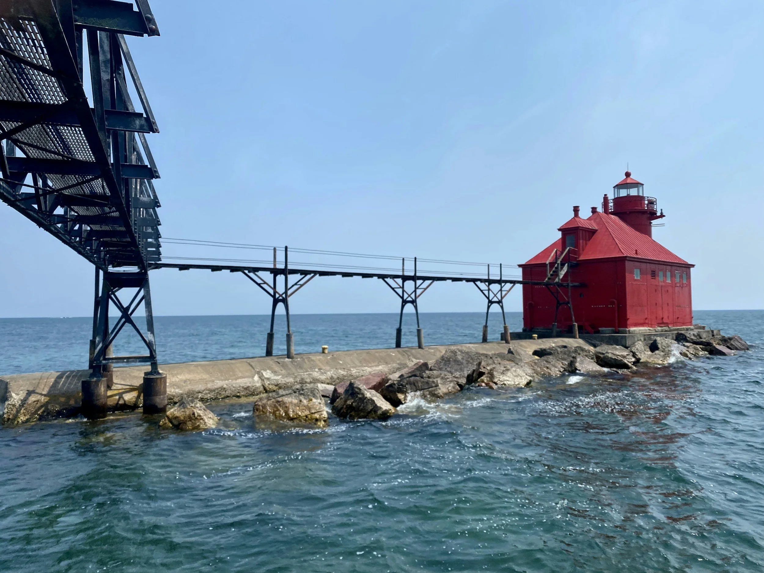 The red Sturgeon Bay Ship Canal lighthouse beside Lake Michigan in Door County, Wisconsin.