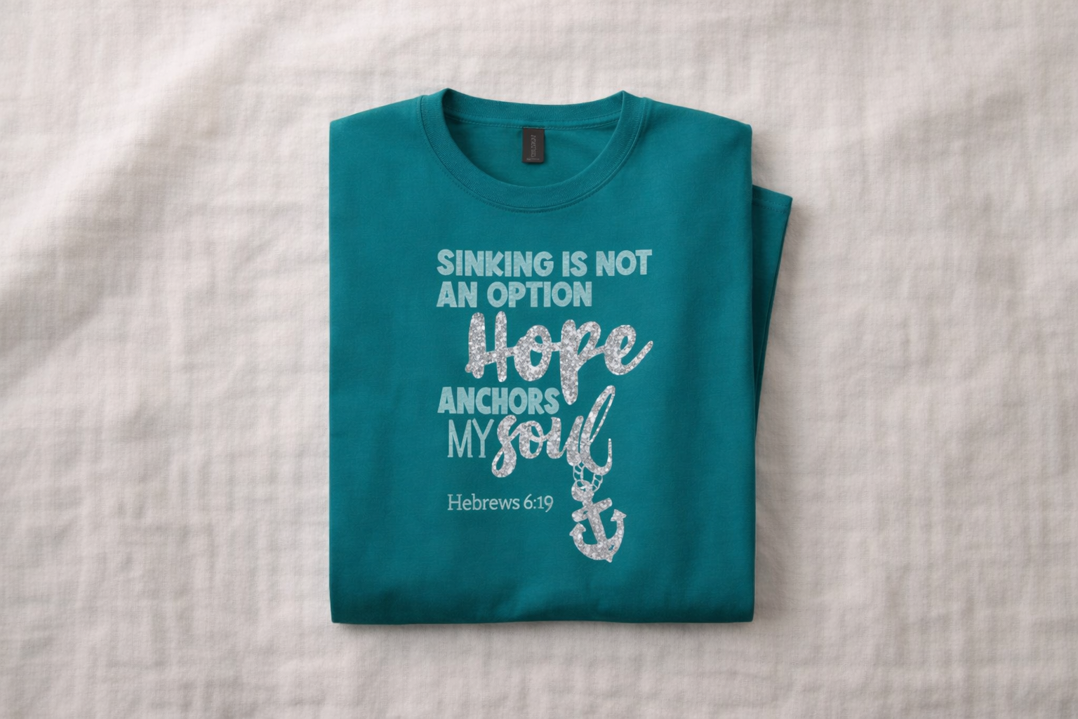 TEAL_Scripture_Tee_FoldedFlatlay.png