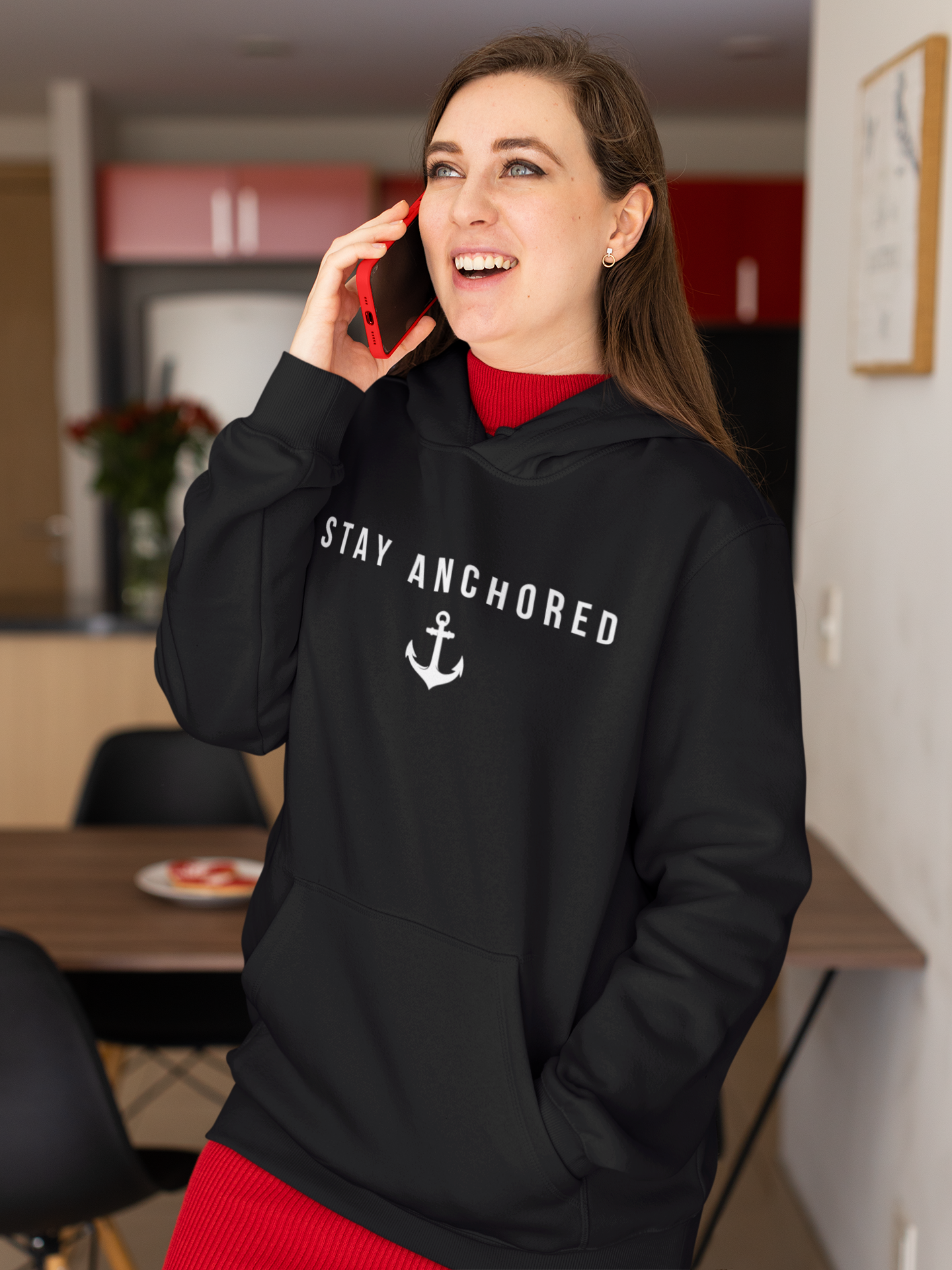 hoodie-mockup-of-a-happy-woman-using-her-cellphone-at-home-m20937.png