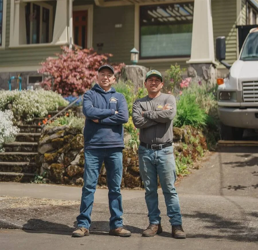 Sunnyside Roofing co-owners Ricardo and Abraham Perez in front of a home