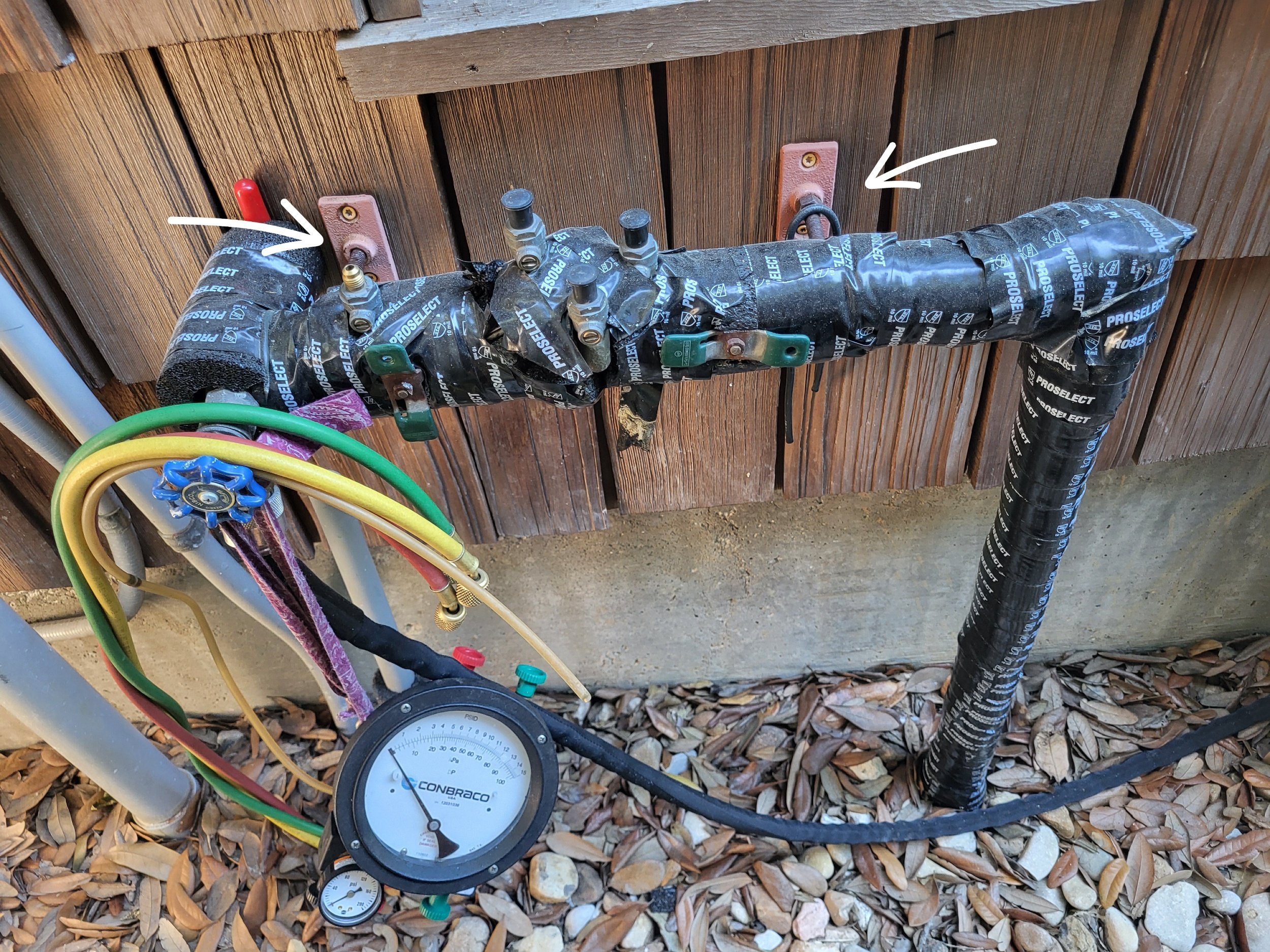 Wall attached pool backflow preventer