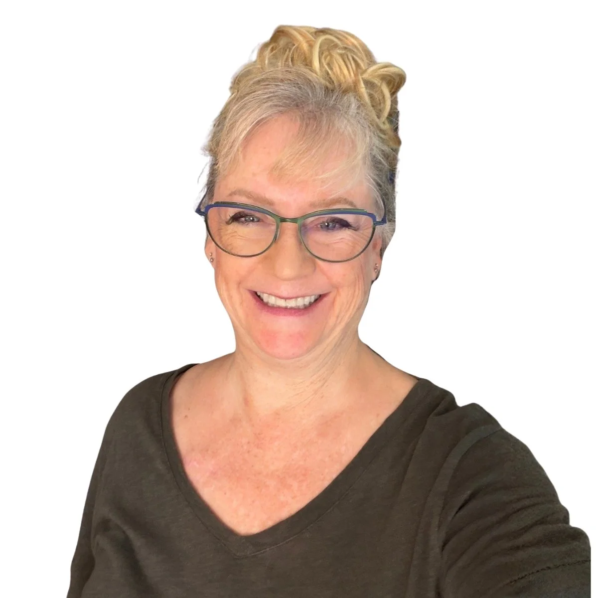 Mature woman with glasses wearing a green shirt