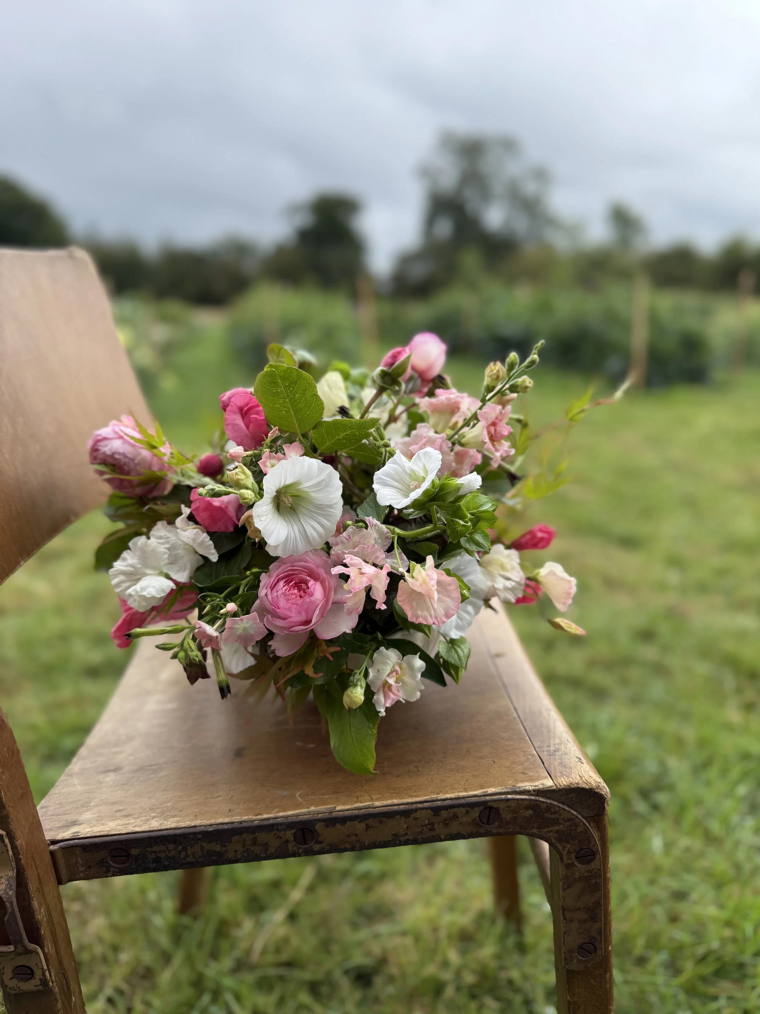 Seasonal bowl arrangement created on a Cheshire flower farm, featuring locally grown flowers and natural foliage.