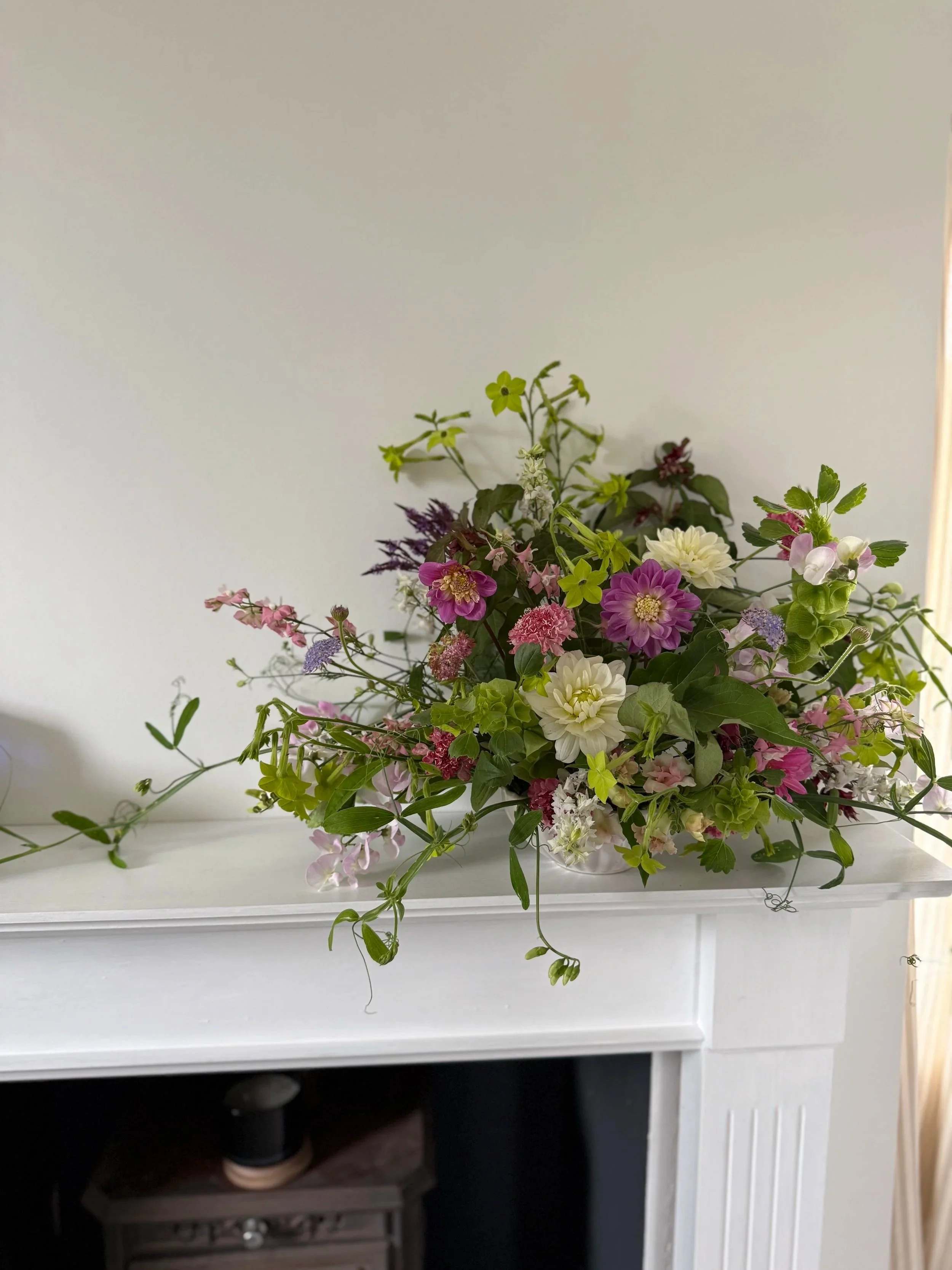 Seasonal bowl arrangement created on a Cheshire flower farm, featuring locally grown flowers and natural foliage.