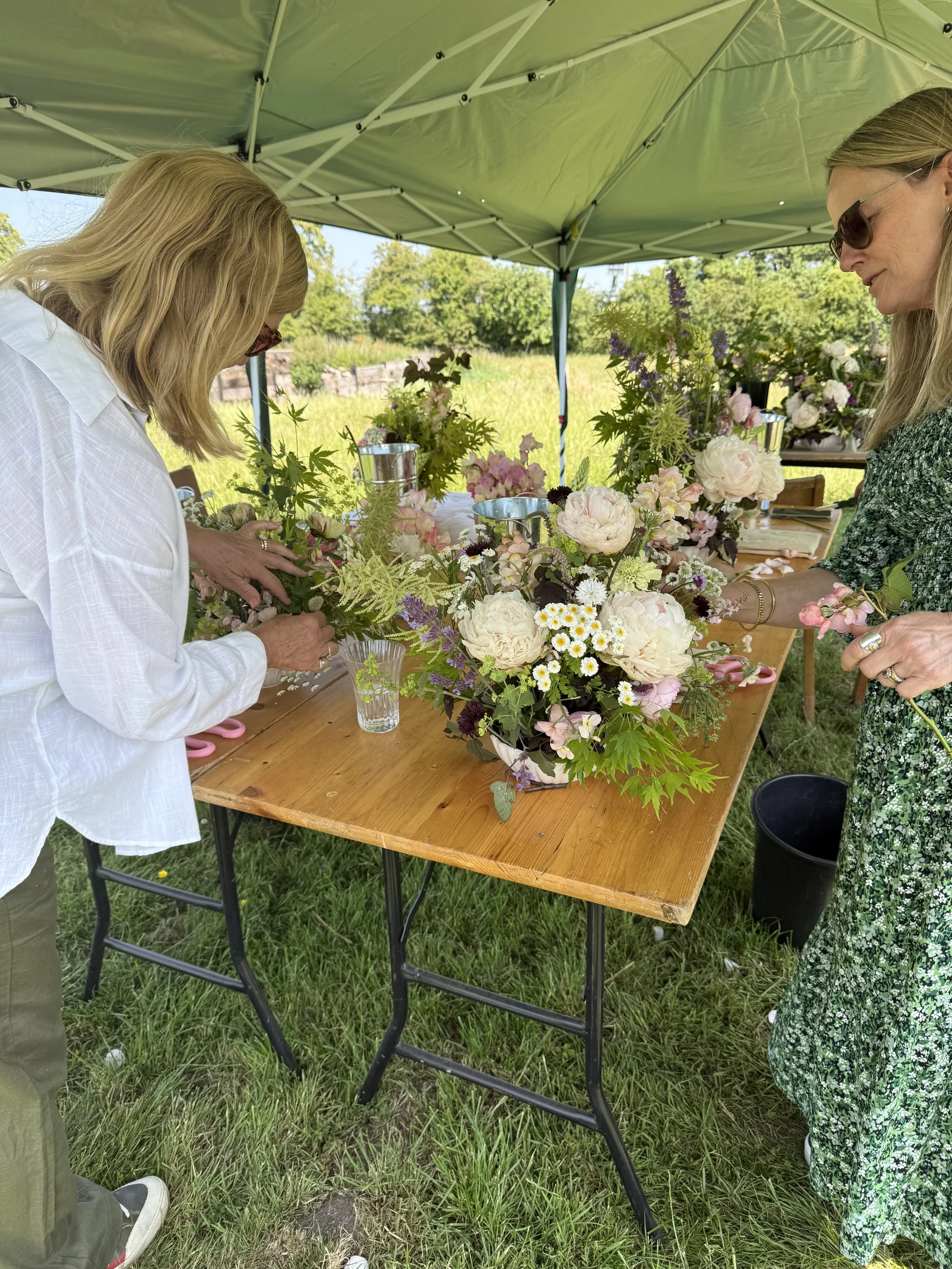 Ladies enjoying floral workshop on Cheshire flower farm
