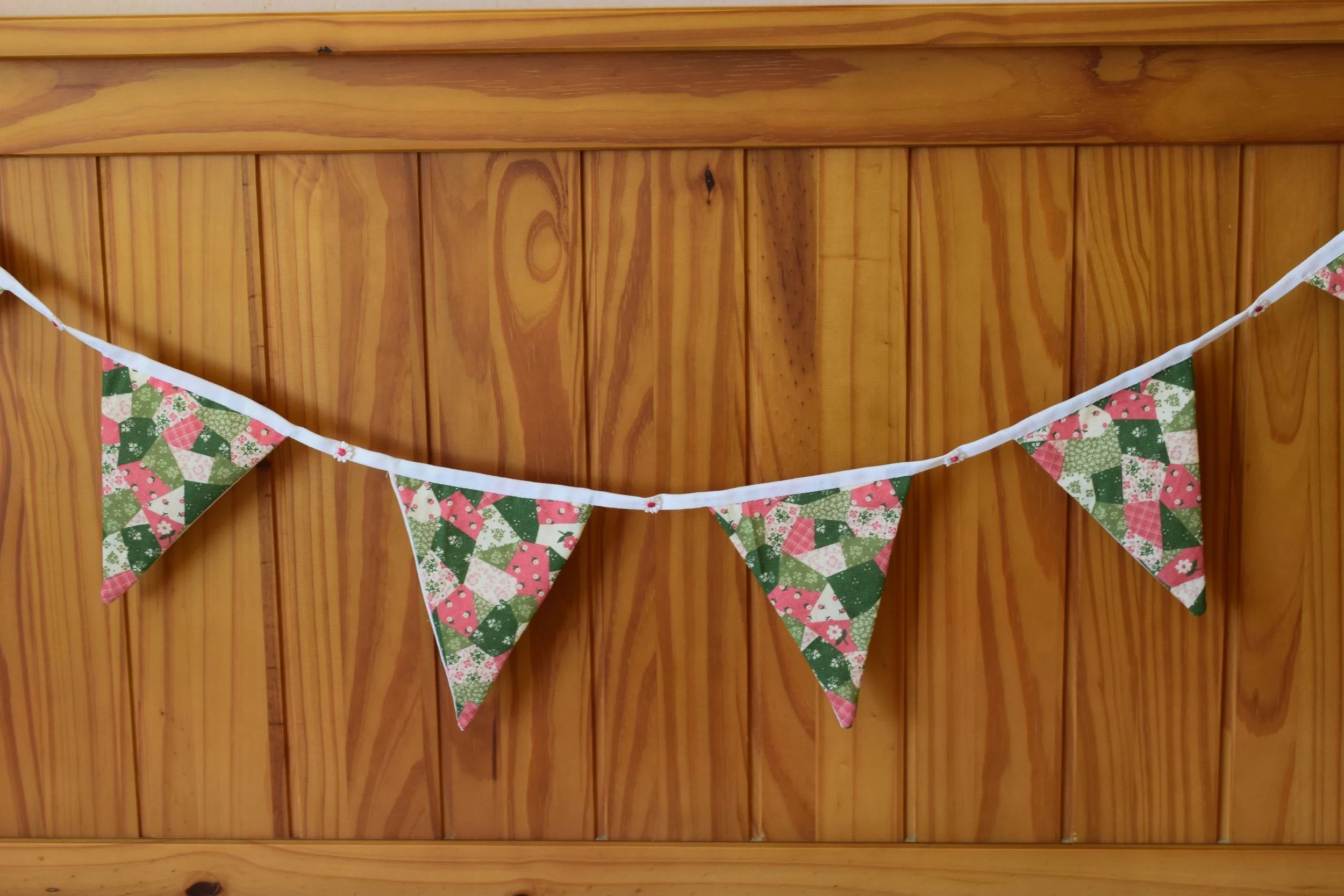 Hand sewn ( No machines) Bunting.  'Pretty pink patchwork with daisies.'