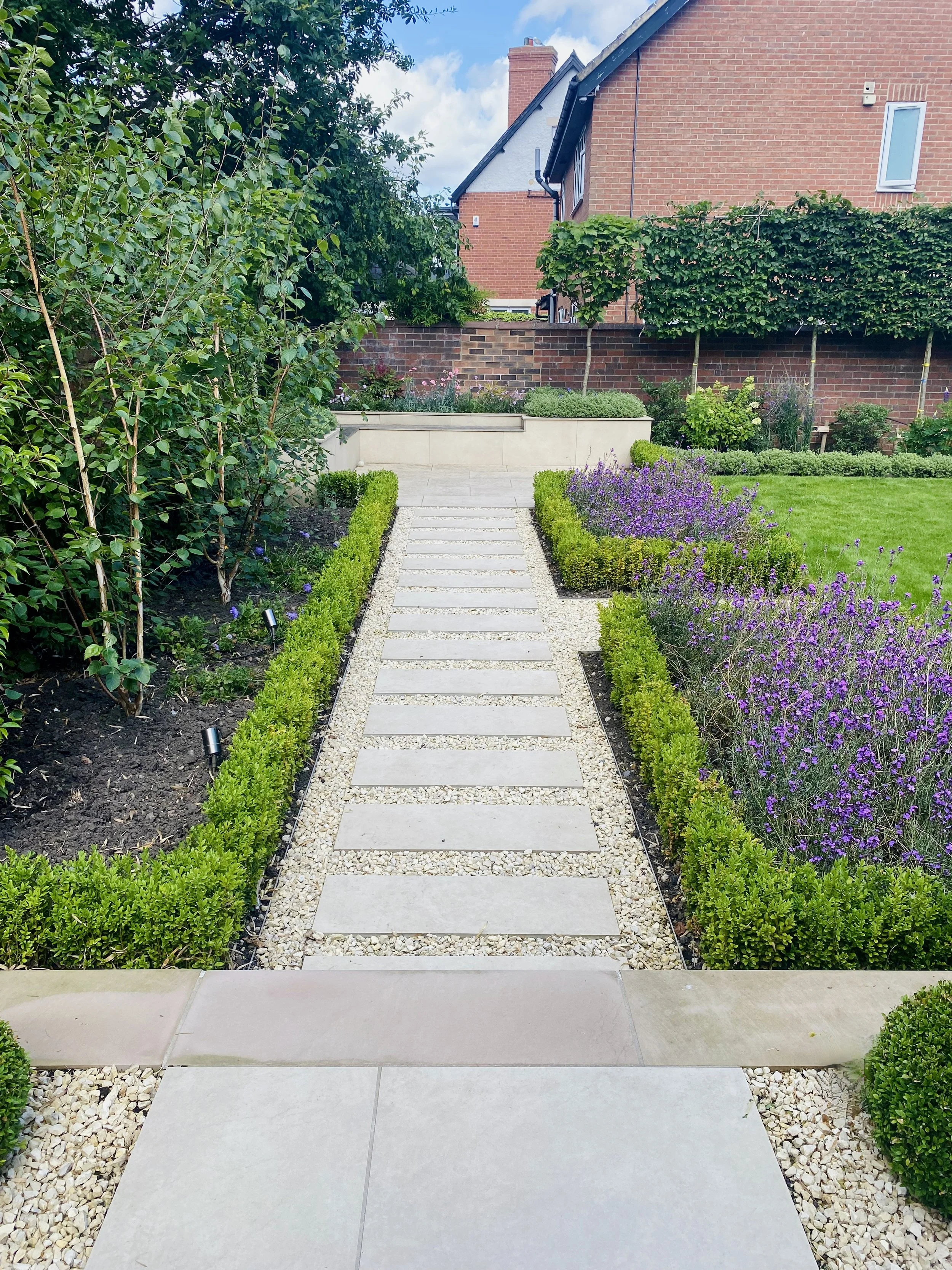 A stepping stone path to the corner seating area