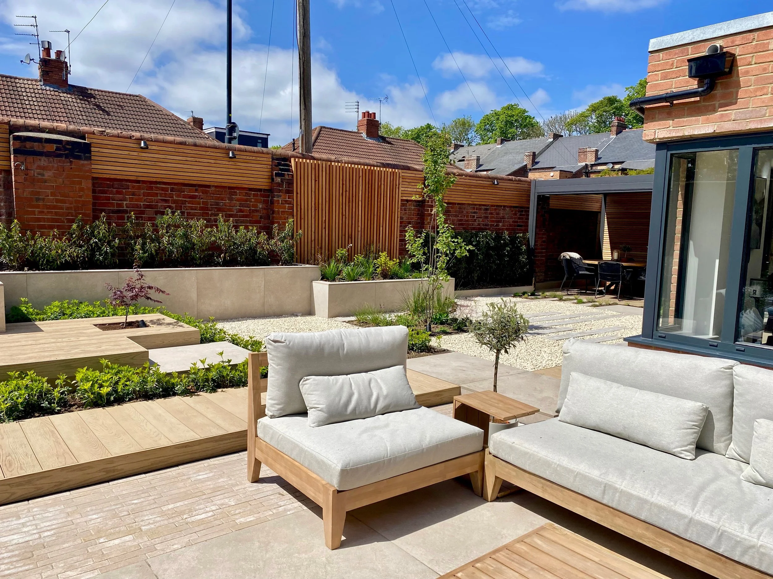 An image showing the sunny patio to the side of the house