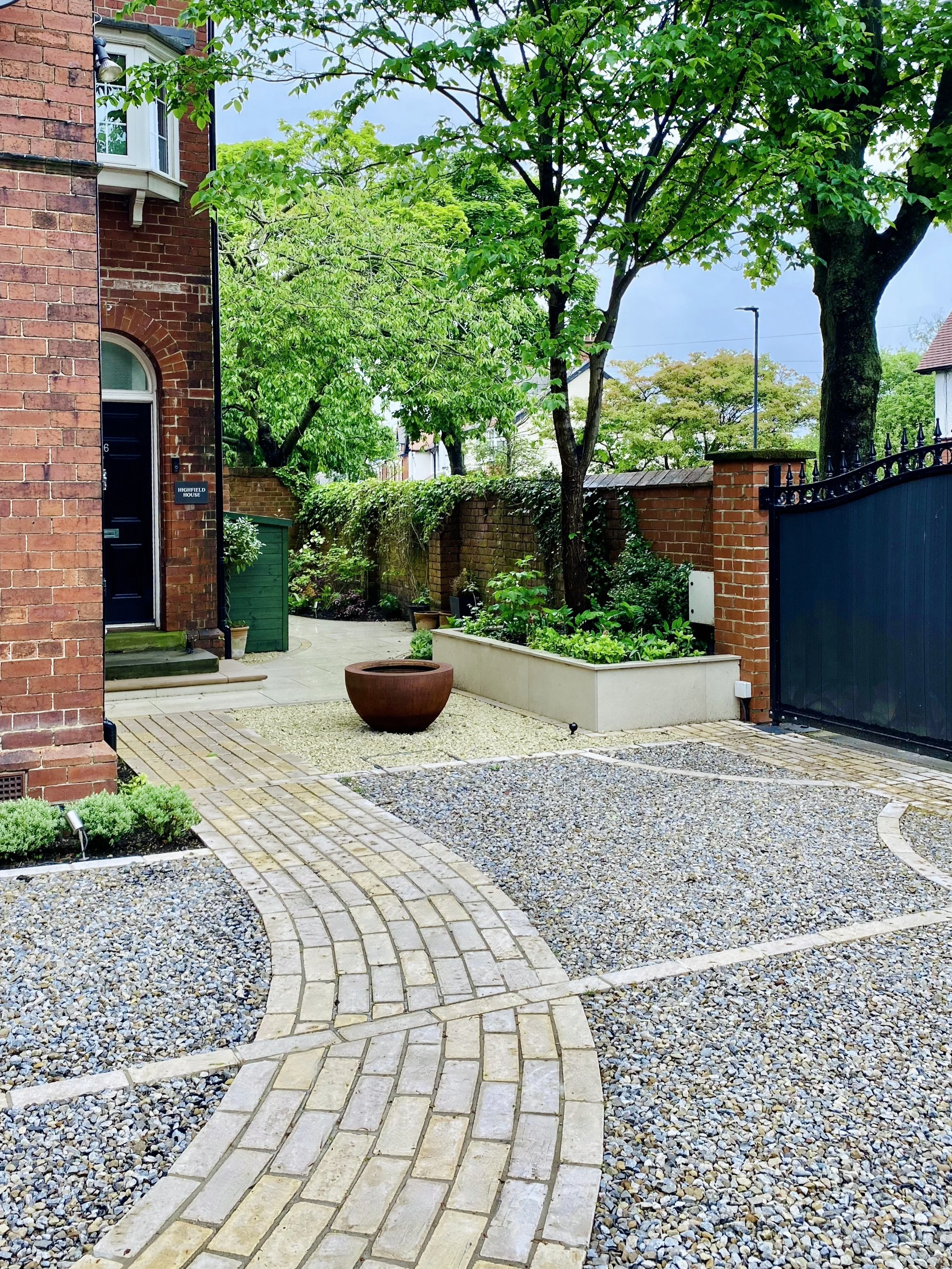 A photograph showing the path leading to the front door