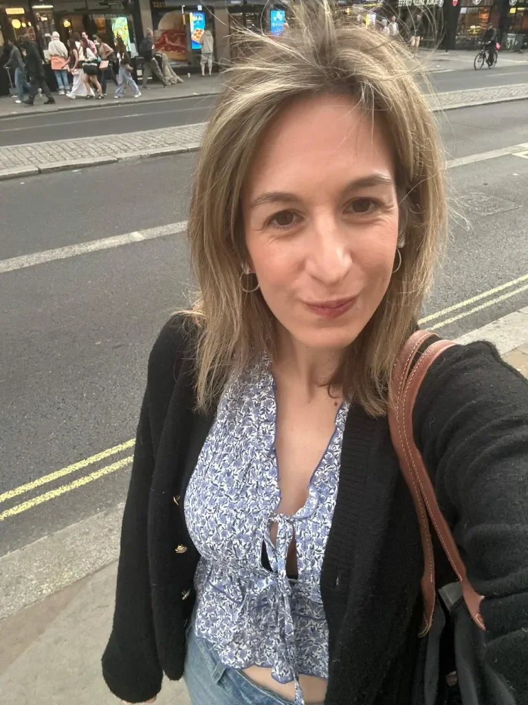 Blonde woman looking up at the camera