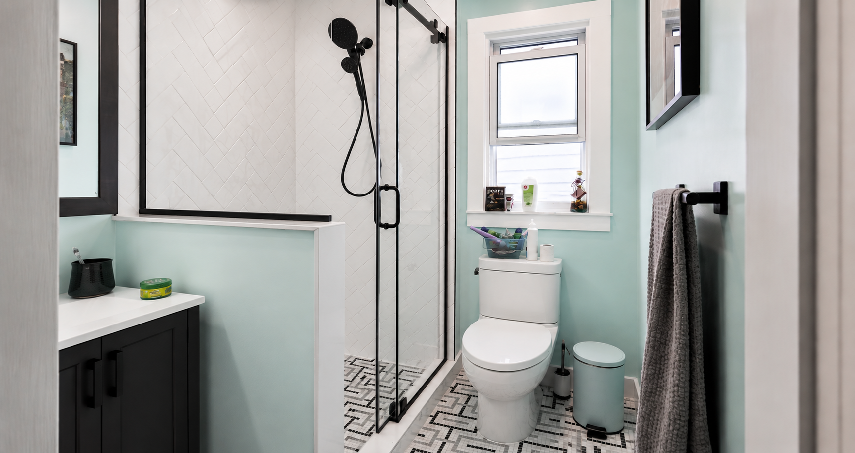 Complete bathroom remodel including walking shower, frameless glass shower enclosure, new toilet, vanity and mirror.