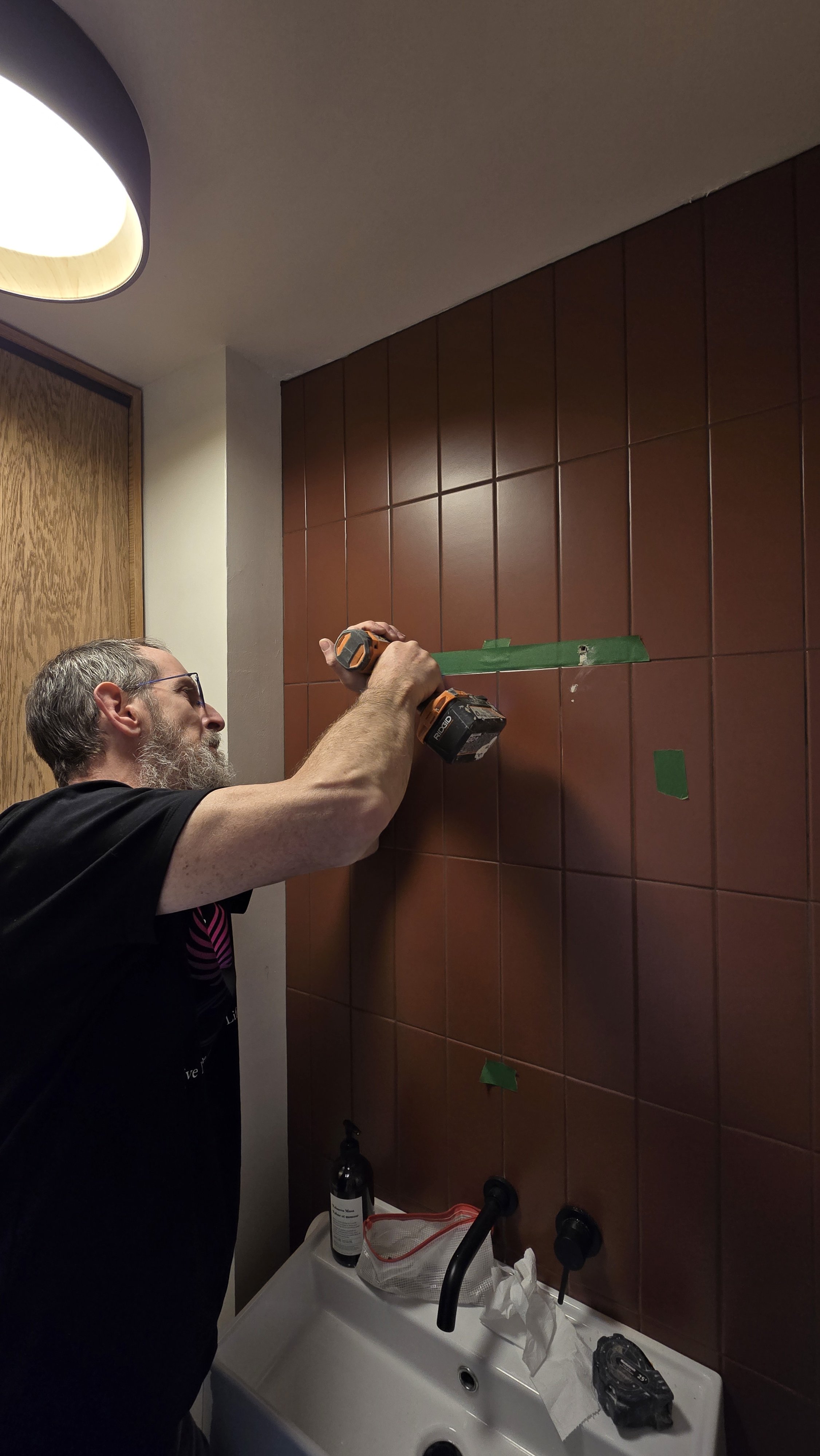 Using tape as a template for mirror installation - Sunningdale, London Ontario