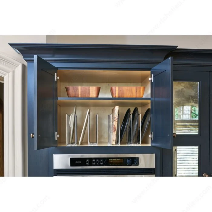 This image shows an upper kitchen cabinet with baking tray organizer