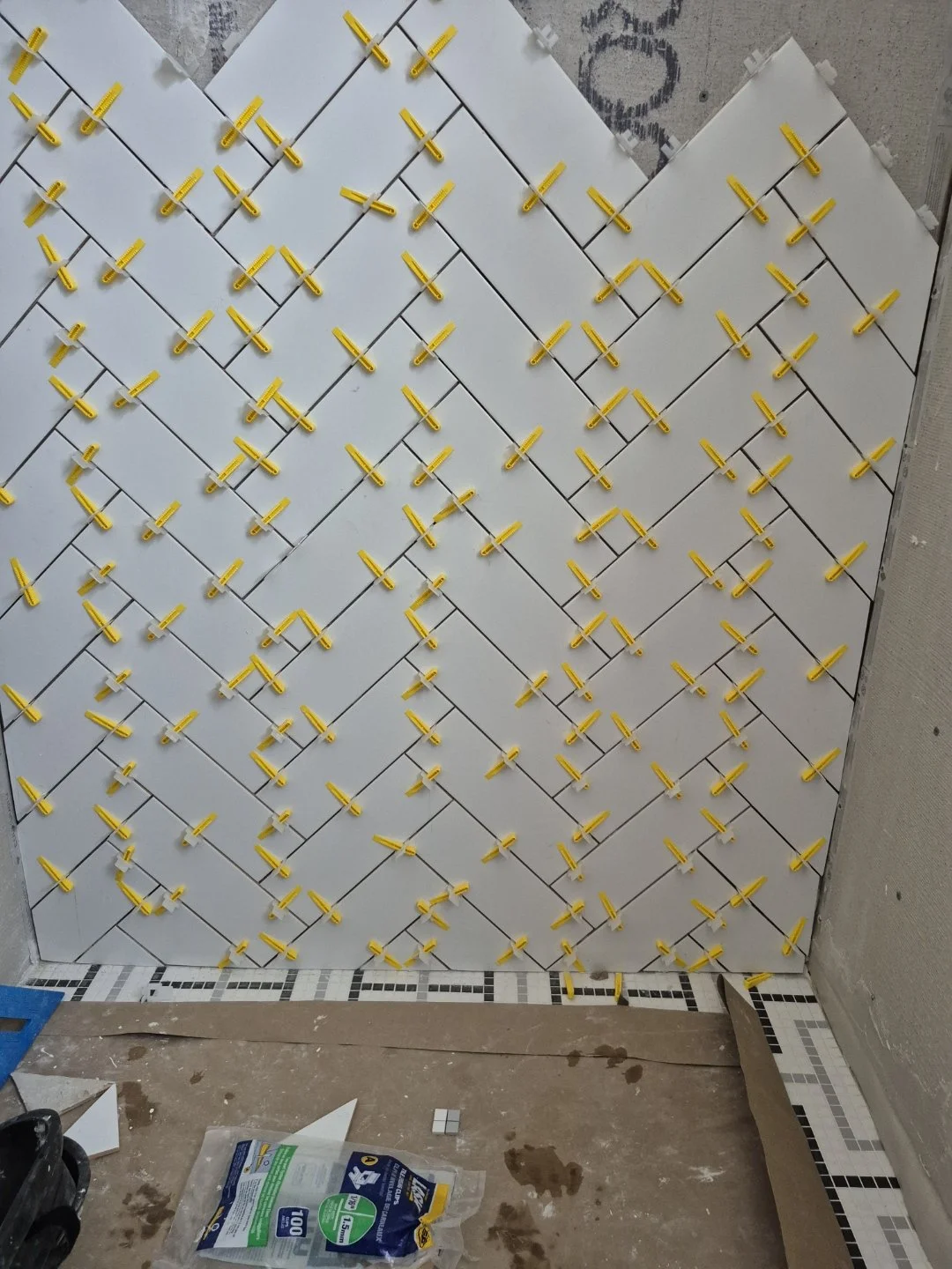 Herringbone Subway Tile from floor to ceiling in custom tiled shower - London Ontario Bathroom renovation