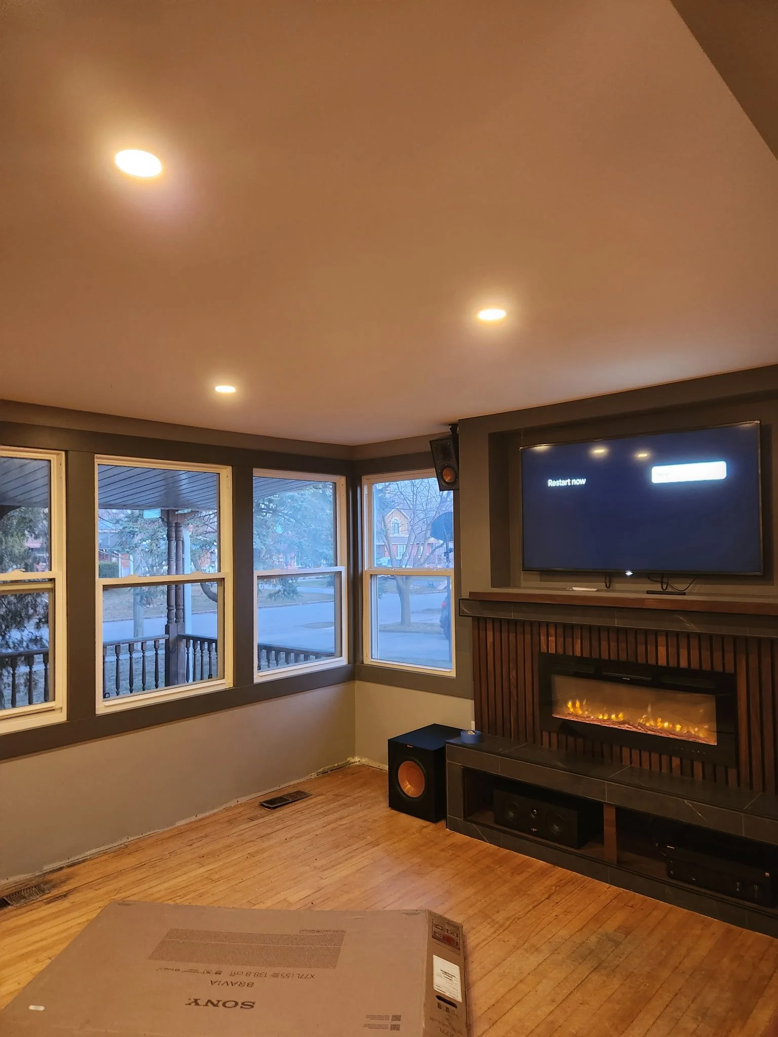 Feature wall with modern trim, custom entertainment and fireplace