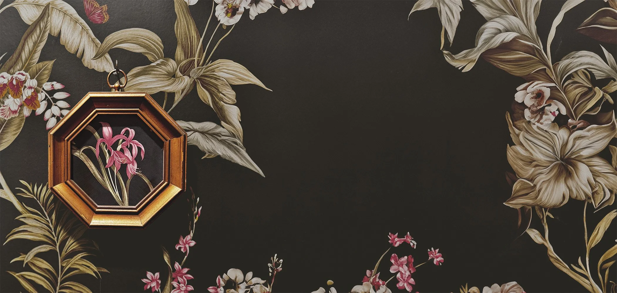 Floral wallpaper with an octagonal frame containing a pink orchid illustration.