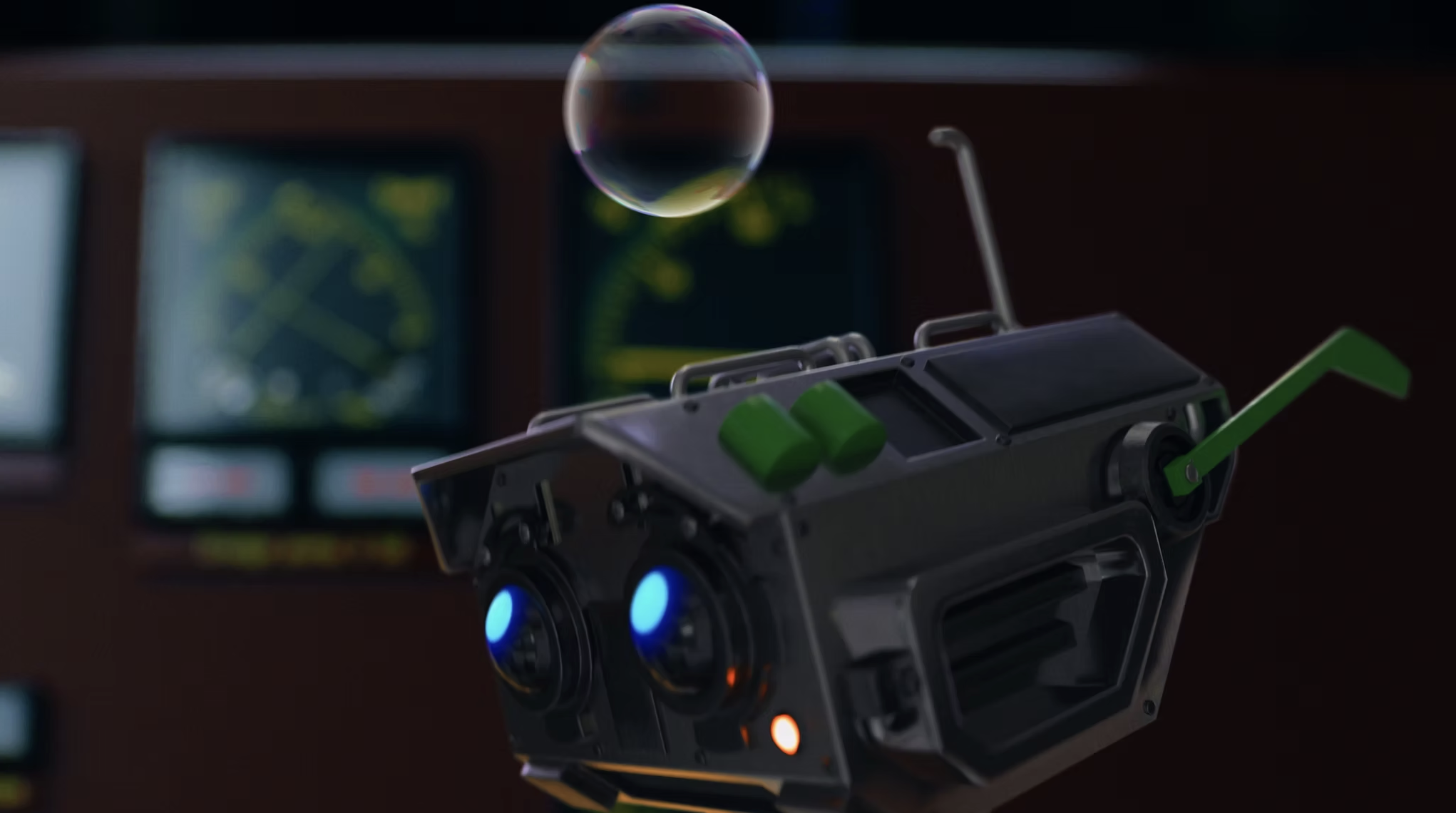 Close-up of a drone controller with blue and orange indicator lights, a small floating soap bubble, and a blurred background of computer screens showing flight data.