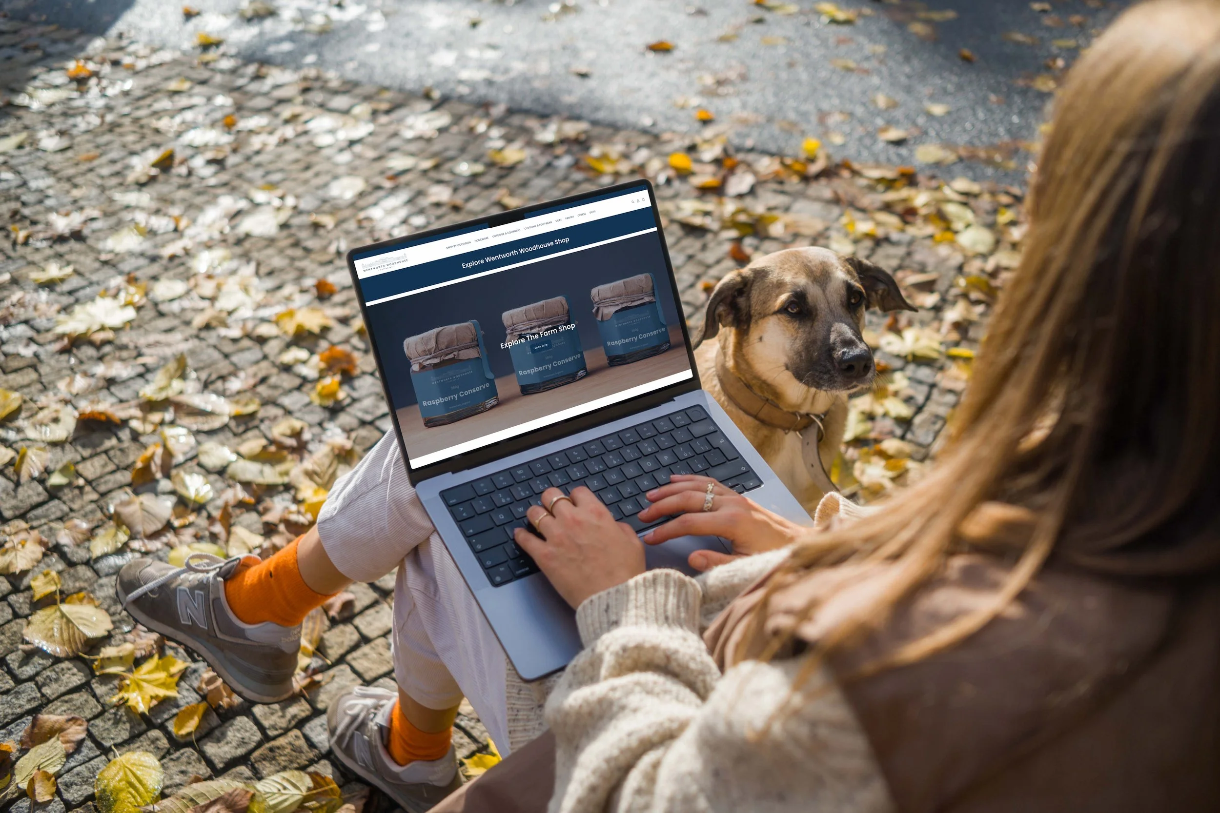 mockuuups-woman-sitting-next-to-the-dog-with-a-macbook-pro-14-mockup.jpeg