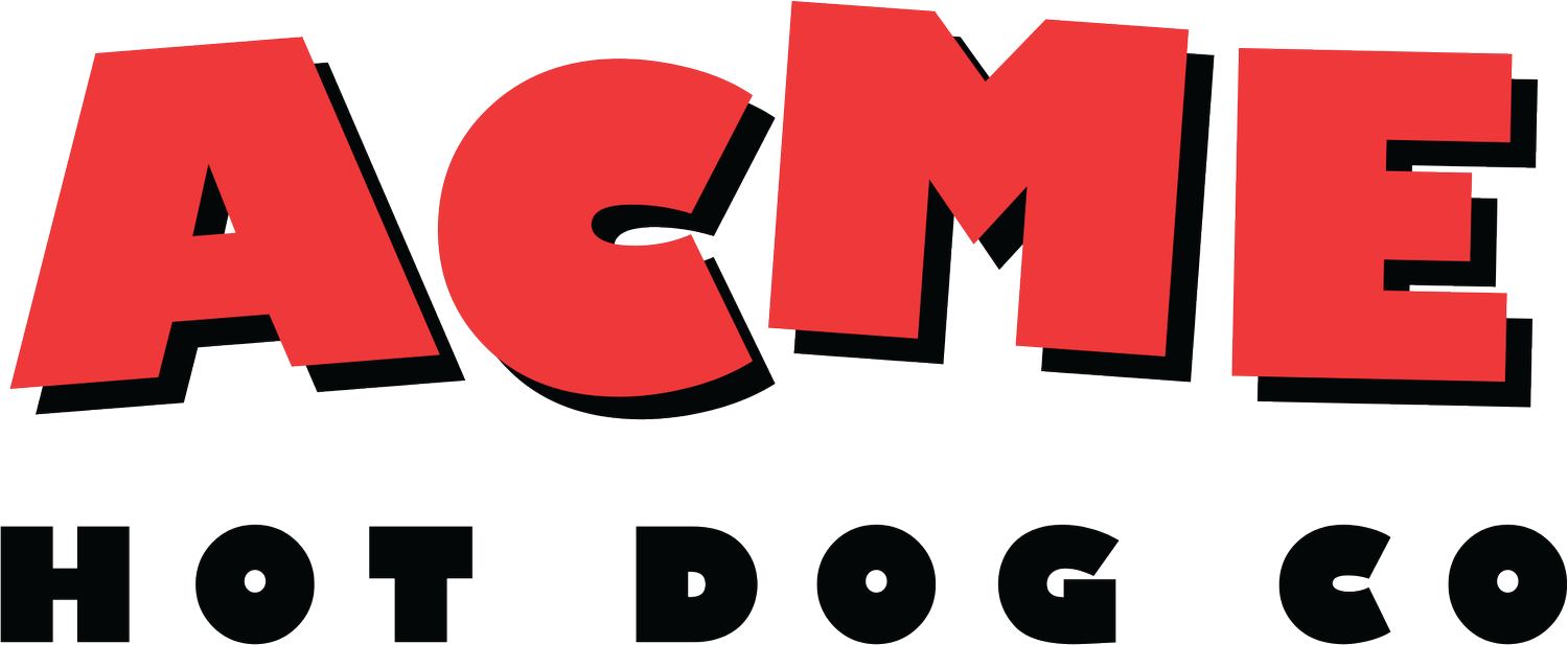 Sign with the words 'ACME' in large red letters with black shadow, and 'HOT DOG CO' in black letters underneath.