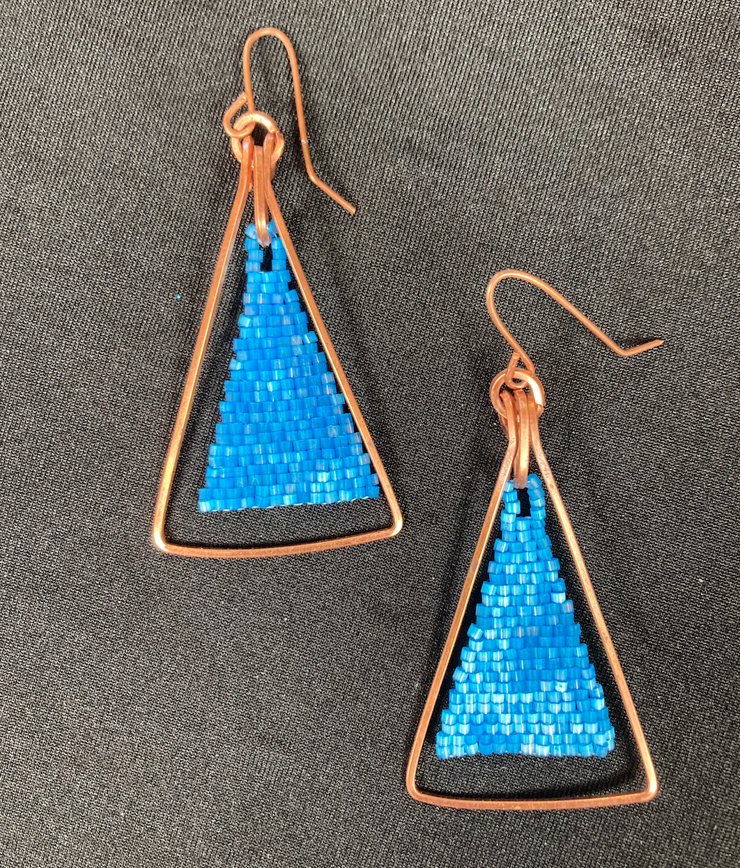 Copper triangle with blue beads