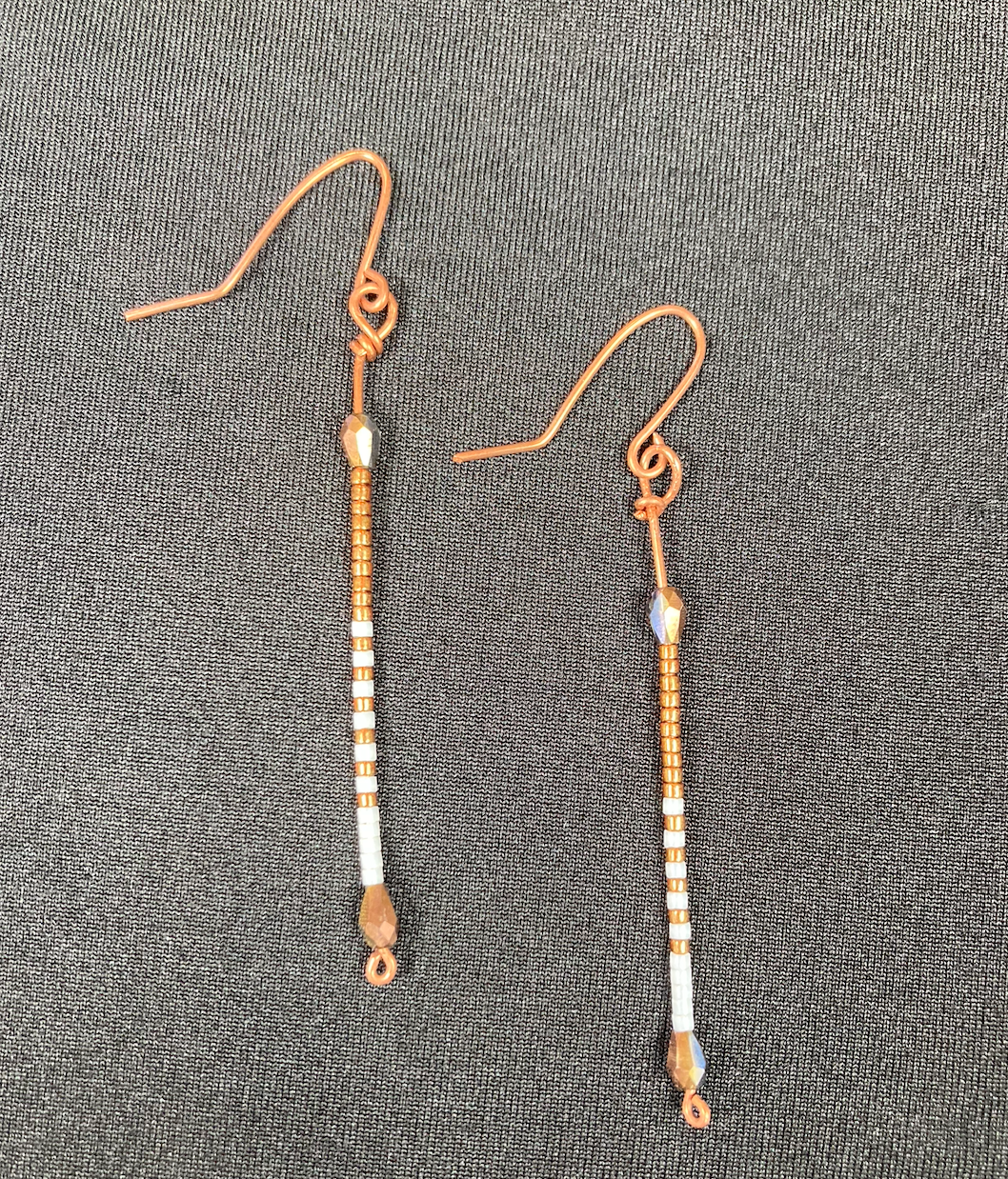 Delicate copper and white beaded sticks