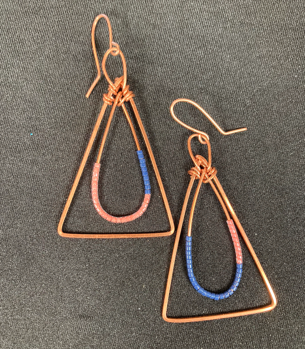 Copper shape nest with asymmetric beads