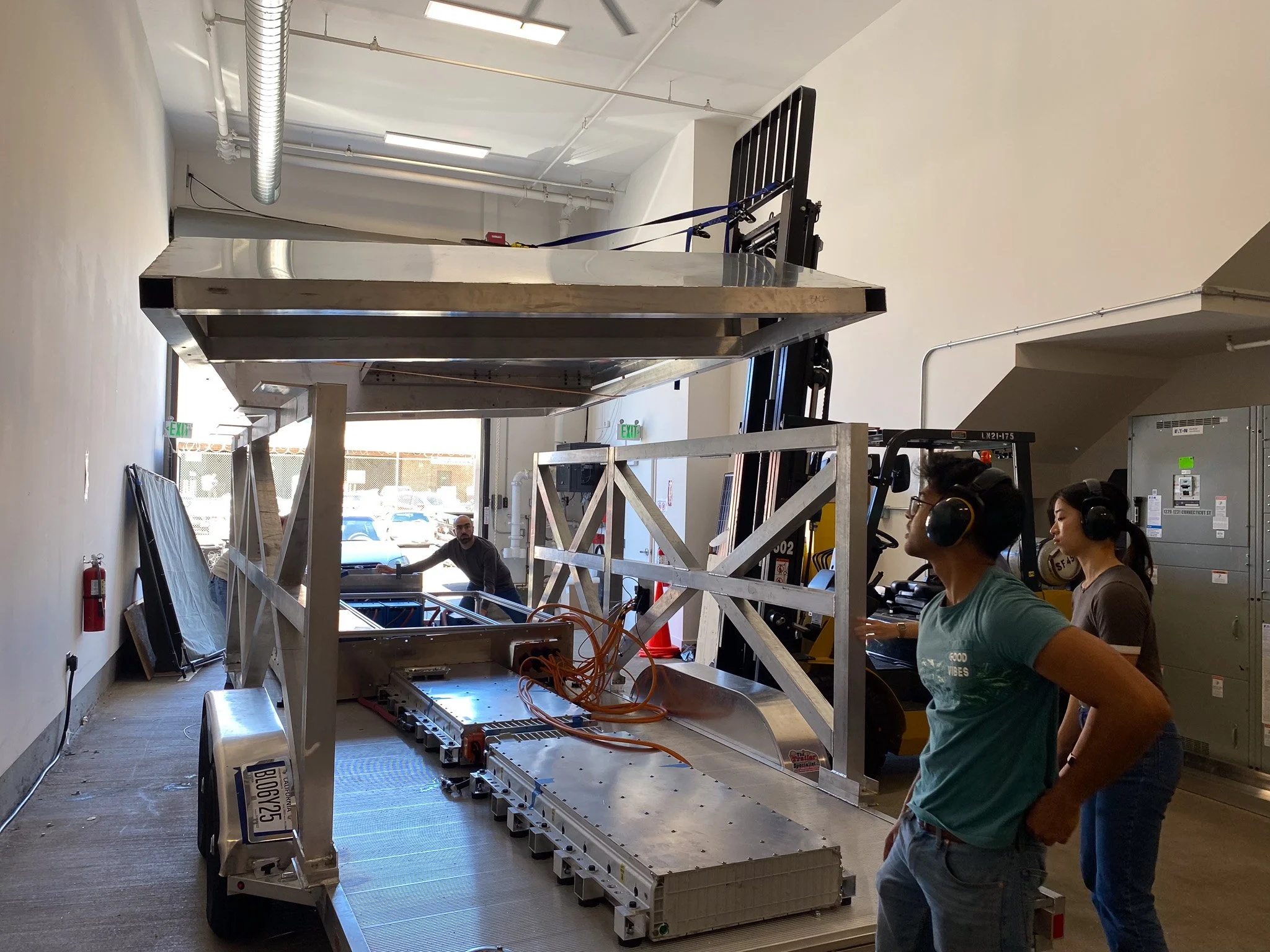 Lowering the canopy on it for the first time, very sketchy but we got it done, everything below the canopy was designed by me except for the thermal system which we assigned an intern to help with.