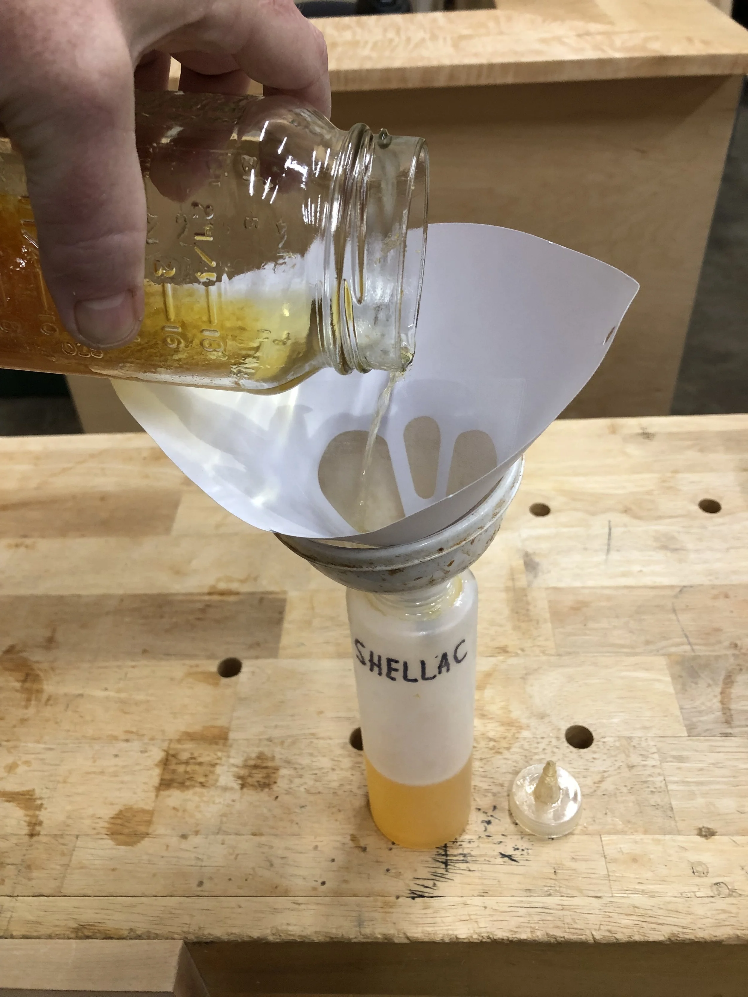 straining shellac