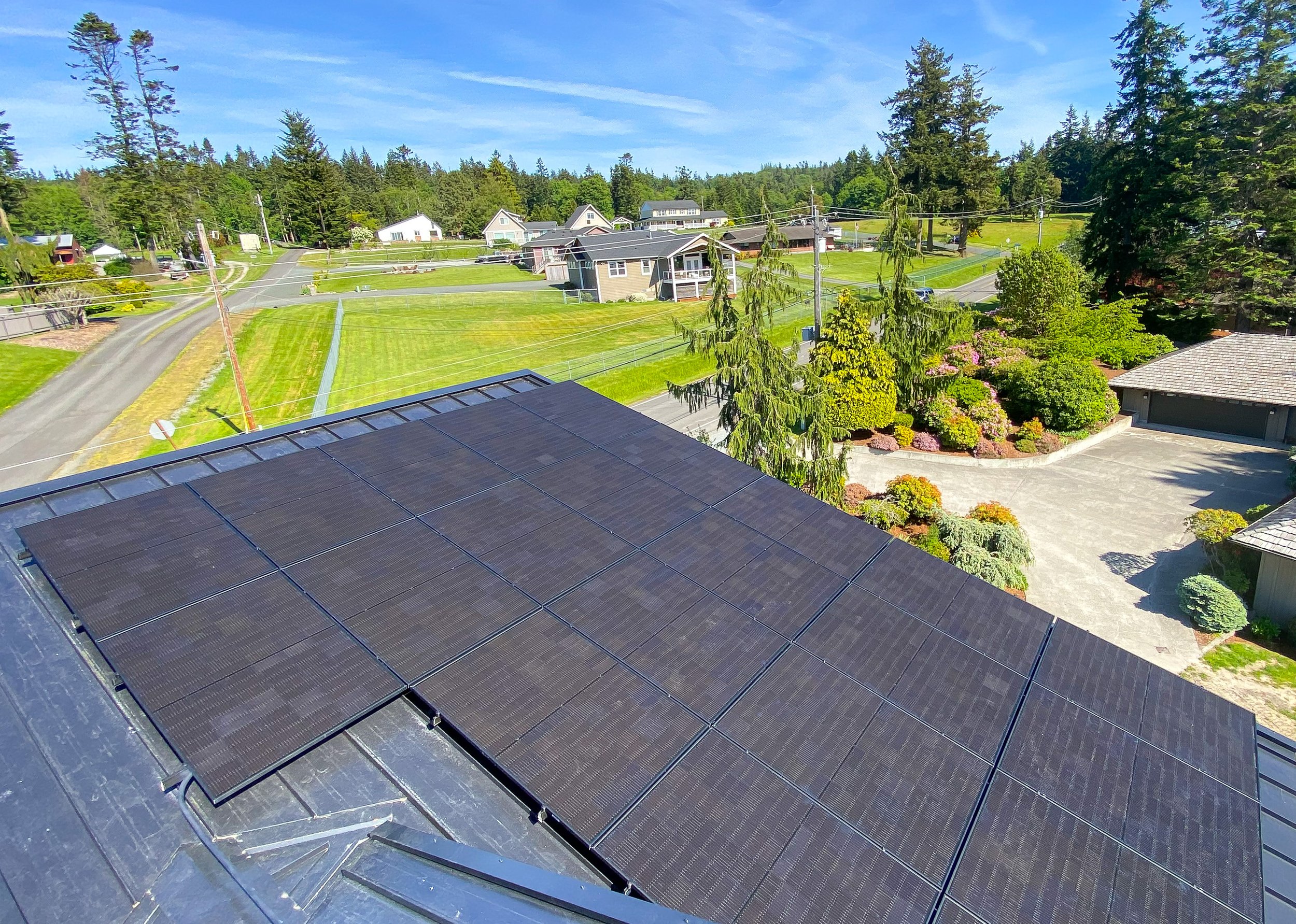 Sunny PV Solar Installation on metal roof.