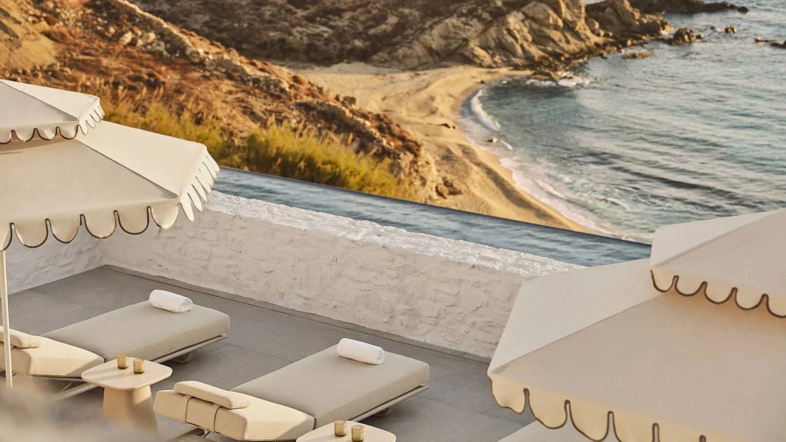 Sun loungers above the beach at Four Seasons Hotel Mykonos on Kalo Livadi Bay