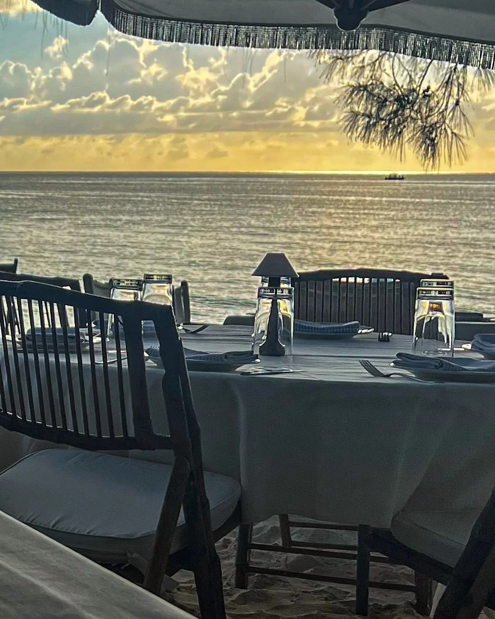 a dinner table in the sand at Tillie's on seven mile beach