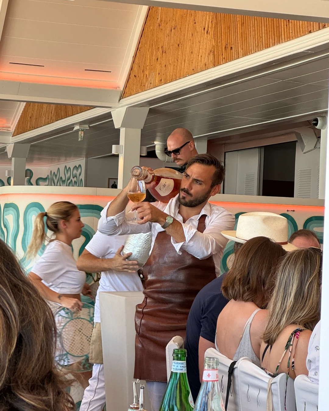 Rosé being poured at Nikki Beach club on St. Jean Beach in St. Barts