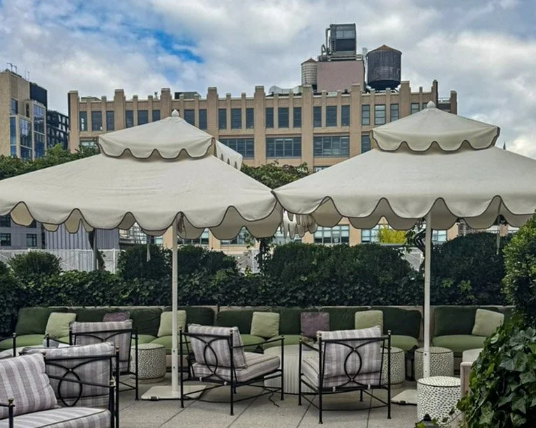 Le Vaux private rooftop terrace with scalloped umbrellas and Tribeca water tower views at Fouquet's New York