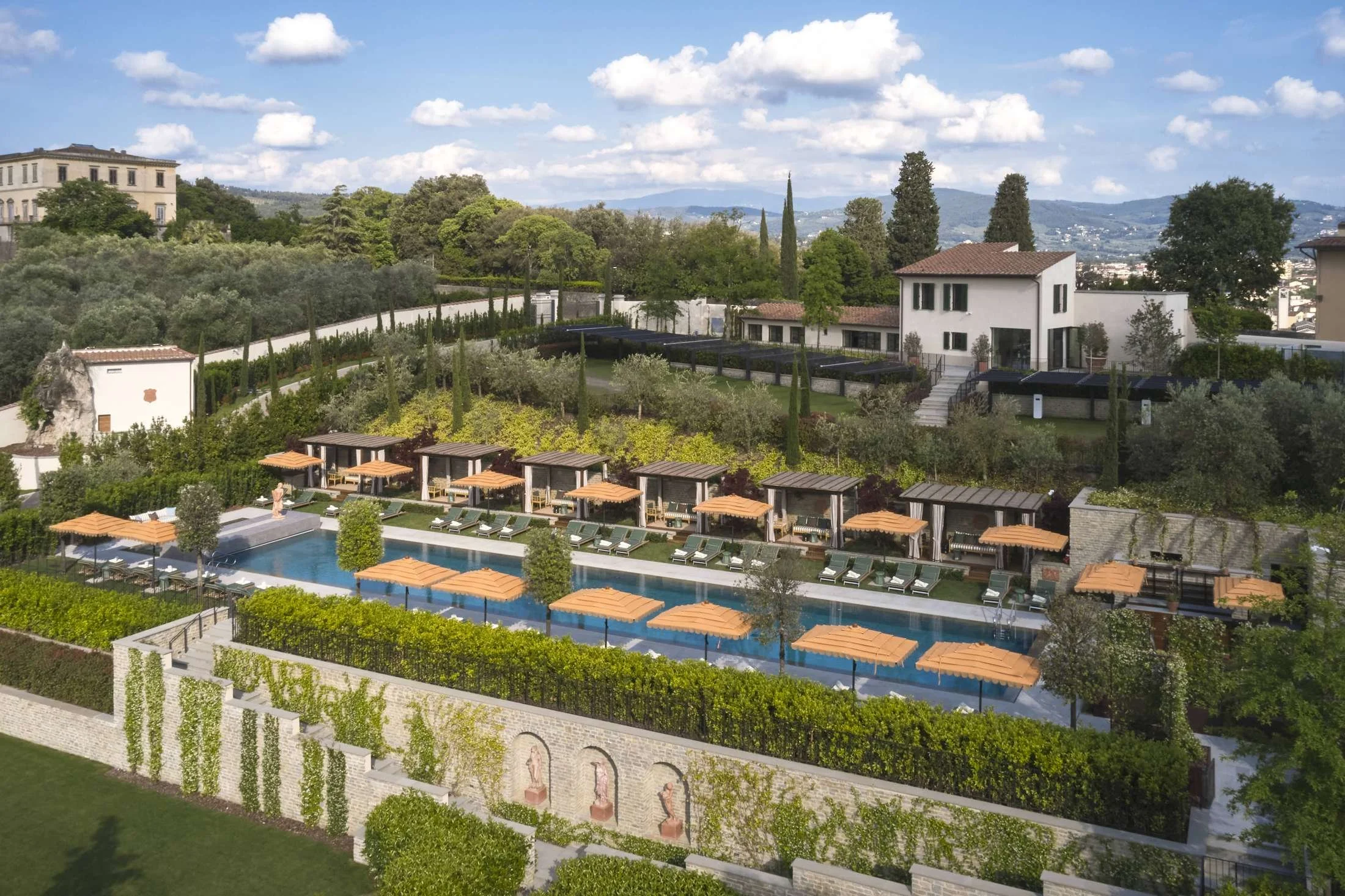 Pool and cabanas in the terraced gardens at Collegio alla Querce, Auberge Resorts Collection, above Florence