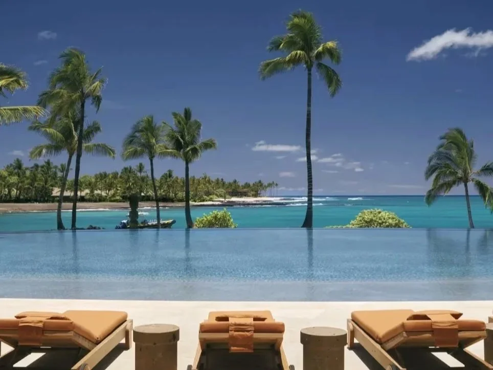 Oceanfront infinity pool overlooking Kahuwai Bay at Rosewood Kona Village on Hawaii Island