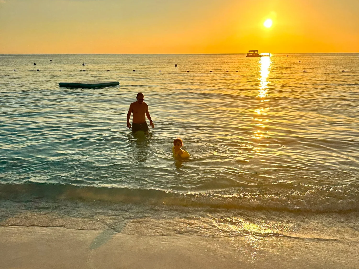 Seven Mile Beach Grand Cayman at sunset, luxury Caribbean beach travel
