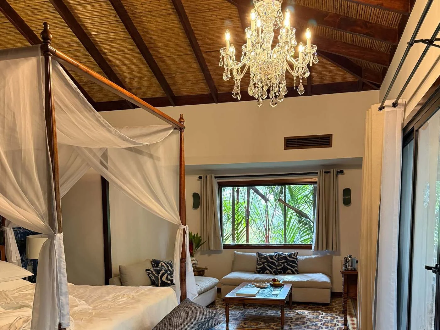 Spacious Springs Villa living room and bedroom setup with high ceilings and rainforest views at Nayara Springs