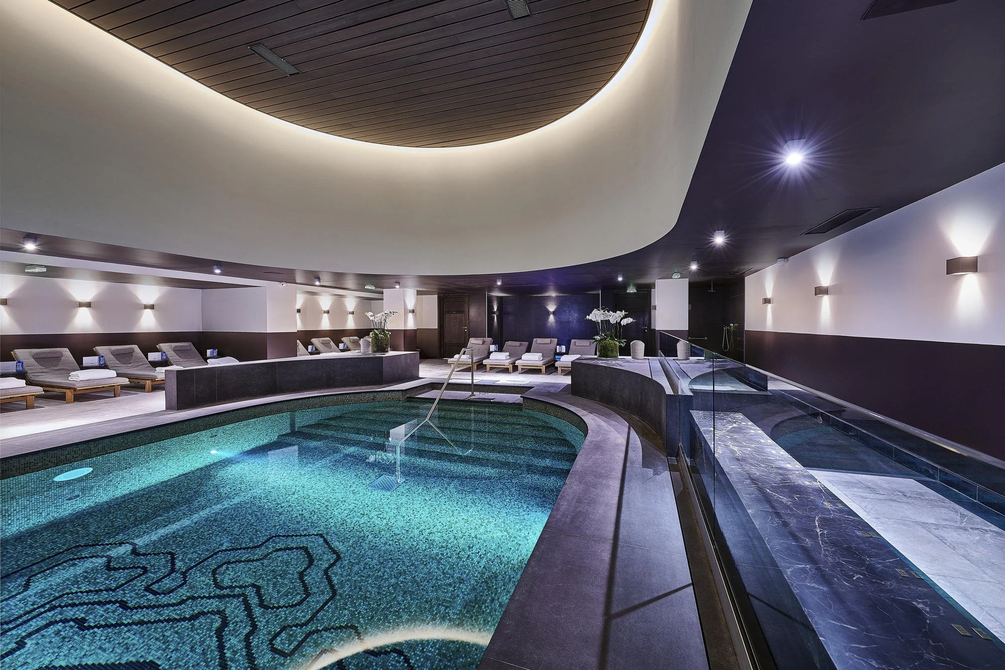 Indoor mosaic swimming pool in the La Prairie spa at L’Apogée Courchevel.